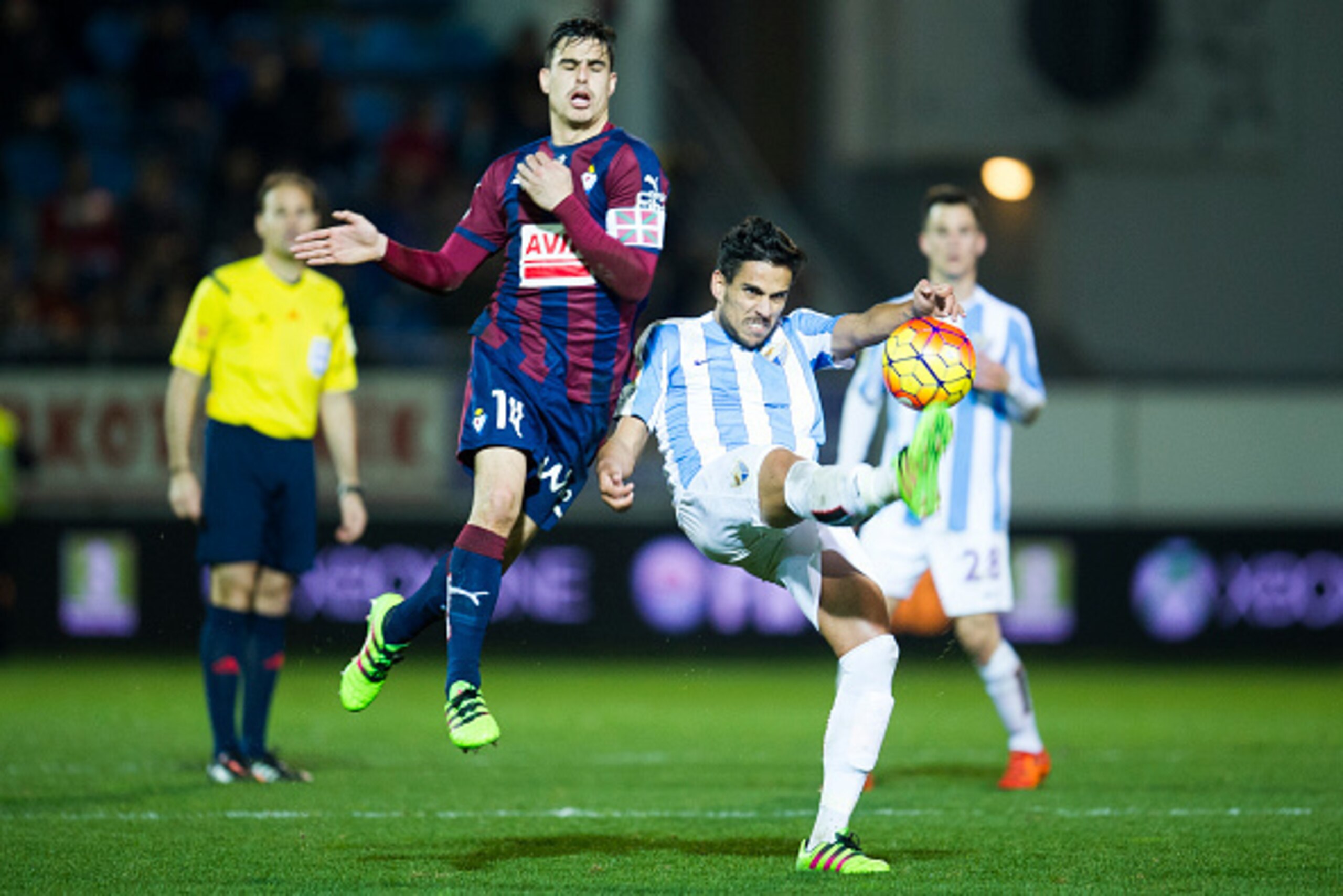 EIBAR, SPAIN - JANUARY 30: Daniel Garcia of SD Eibar duels for the ball with Recio of Malaga CF during the La Liga match between SD Eibar and Malaga CF at Ipurua Municipal Stadium on January 30, 2016 in Eibar, Spain. (Photo by Juan Manuel Serrano Arce/Ge EIBAR, SPAIN - JANUARY 30: Daniel Garcia of SD Eibar duels for the ball with Recio of Malaga CF during the La Liga match between SD Eibar and Malaga CF at Ipurua Municipal Stadium on January 30, 2016 in Eibar, Spain. (Photo by Juan Manuel Serrano Arce/Ge