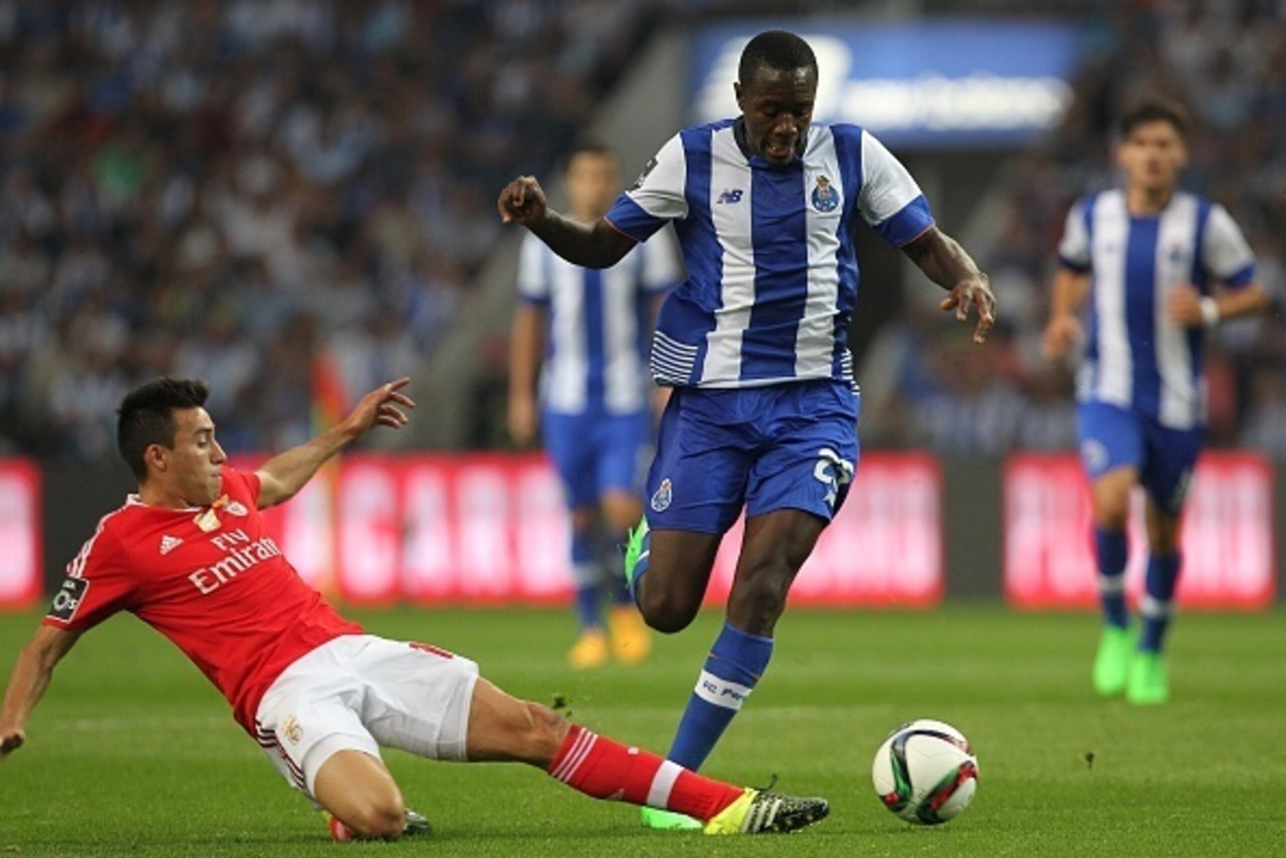 PORTO, PORTUGAL - SEPTEMBER 20: Benfica's midfielder Nicolas Gaitan tries to stop Porto's midfielder Gianelli Imbula  during the match between FC Porto and SL Benfica for the Portuguese Primeira Liga at Estadio do Dragao on September 20, 2015 in Porto, Po