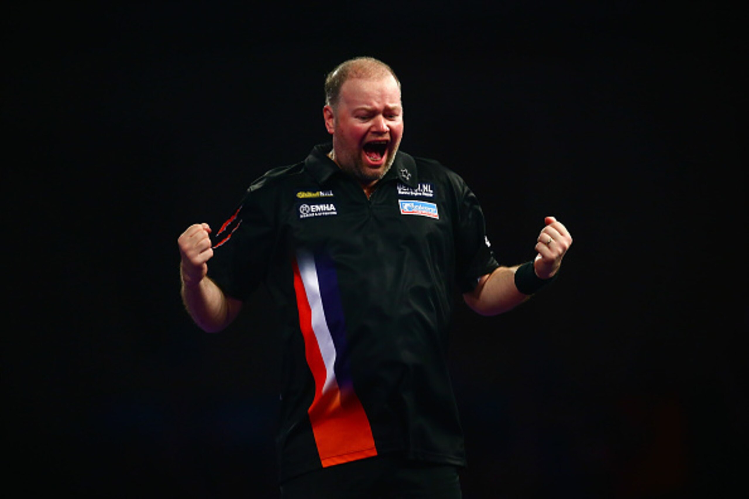 LONDON, ENGLAND - DECEMBER 29:  Raymond van Barneveld of Holland celebrates a set point in his third round match against Michael van Gerwen of Holland on Day Eleven of the 2016 William Hill PDC World Darts Championships at Alexandra Palace on December 29,