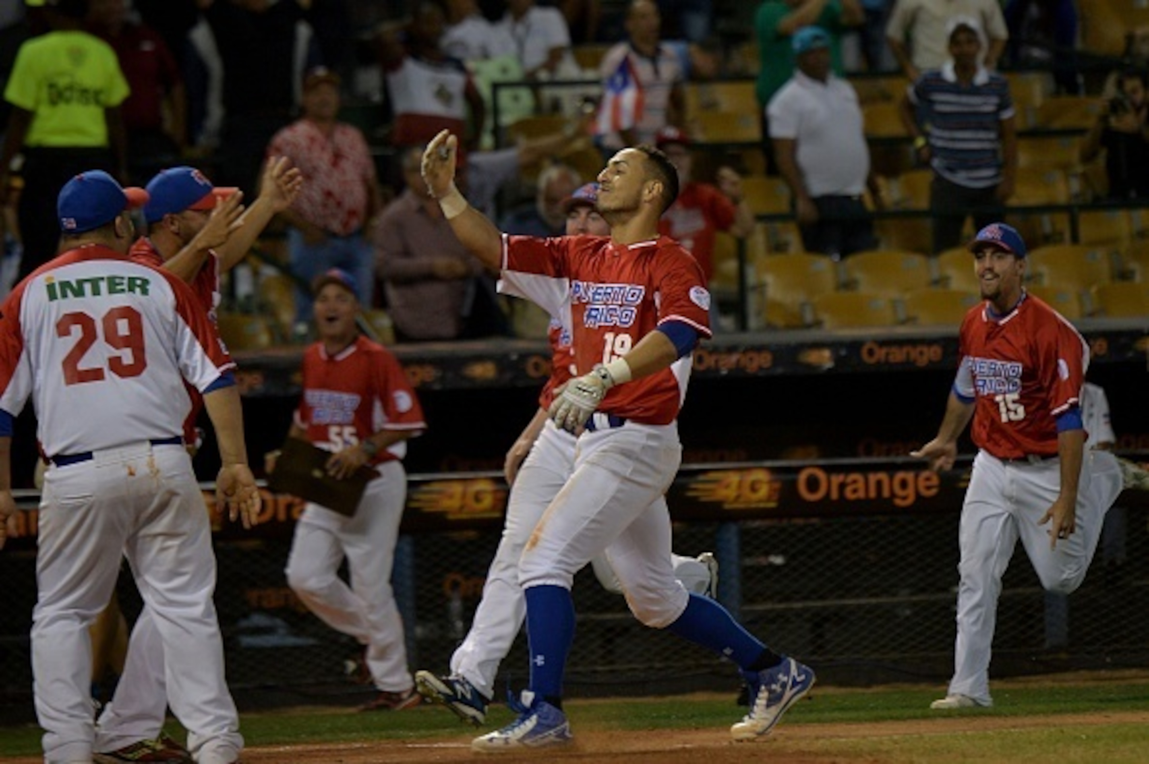 Neftali Soto (C) of Puerto Rican celebrates a homerun definitive against Dominican Republic during their 2016 Caribbean baseball series game, on February 4, In Santo Domingo city, Dominican Republic.   
 / AFP / YAMIL LAGE        (Photo credit should read