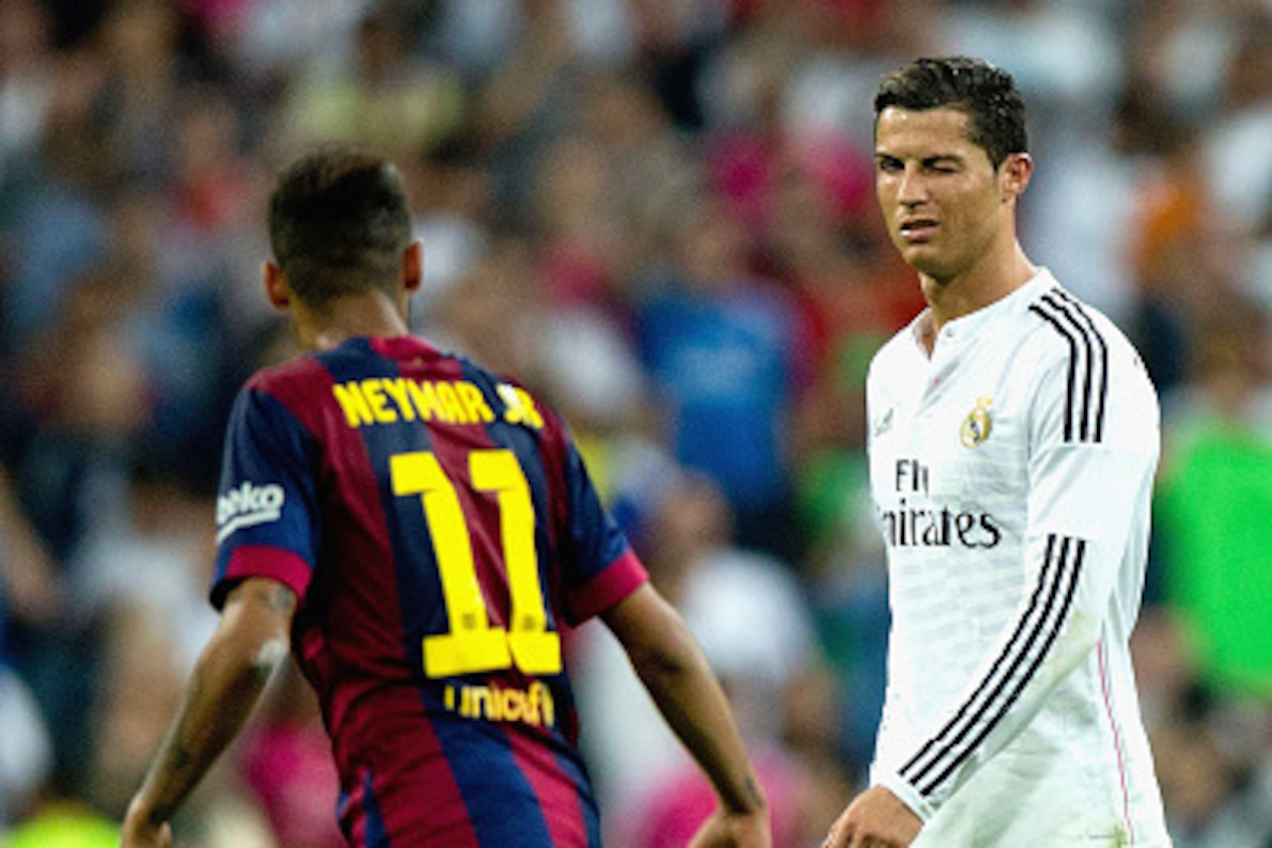 MADRID, SPAIN - OCTOBER 25: Cristiano Ronaldo of Real Madrid CF winks at Neymar of Barcelona during the La Liga match between Real Madrid CF and FC Barcelona at Estadio Santiago Bernabeu on October 25, 2014 in Madrid, Spain. (Photo by Gonzalo Arroyo Mor MADRID, SPAIN - OCTOBER 25: Cristiano Ronaldo of Real Madrid CF winks at Neymar of Barcelona during the La Liga match between Real Madrid CF and FC Barcelona at Estadio Santiago Bernabeu on October 25, 2014 in Madrid, Spain. (Photo by Gonzalo Arroyo Mor