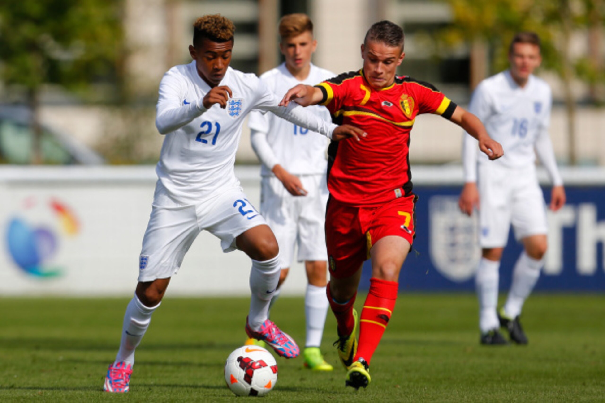 BURTON-UPON-TRENT, ENGLAND - AUGUST 20: Reiss Nelson (L) of England U16's in action with Thibaut Verlinden of Belgium U16's during the International U16 fixture between England and Belgium at St George's Park on August 20, 2014 in Burton-Upon-Trent, Engla