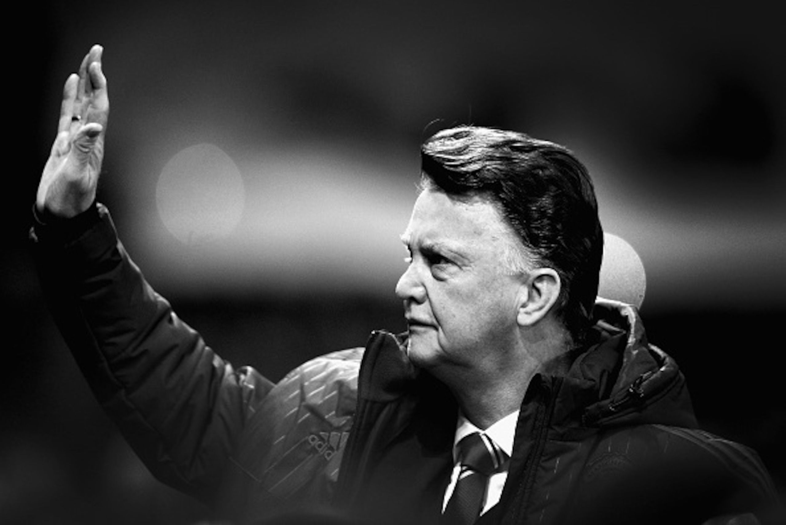 MANCHESTER, ENGLAND - FEBRUARY 02:  (EDITORS NOTE: Image has been converted to black and white) Louis van Gaal of Manchester United waves to the crowd before the Barclays Premier League match between Manchester United and Stoke City at Old Trafford on Feb
