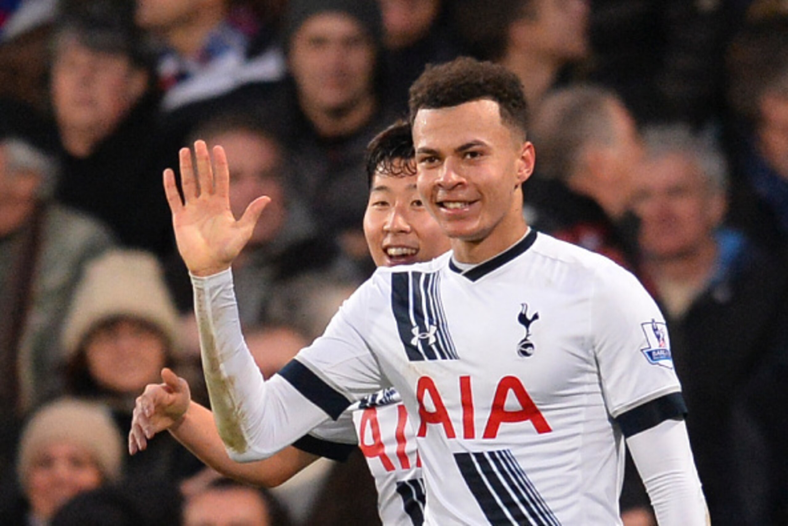 Tottenham Hotspur's English midfielder Dele Alli (R) celebrates scoring their second goal during the English Premier League football match between Crystal Palace and Tottenham Hotspur at Selhurst Park in south London on January 23, 2016. AFP PHOTO / GLYN 