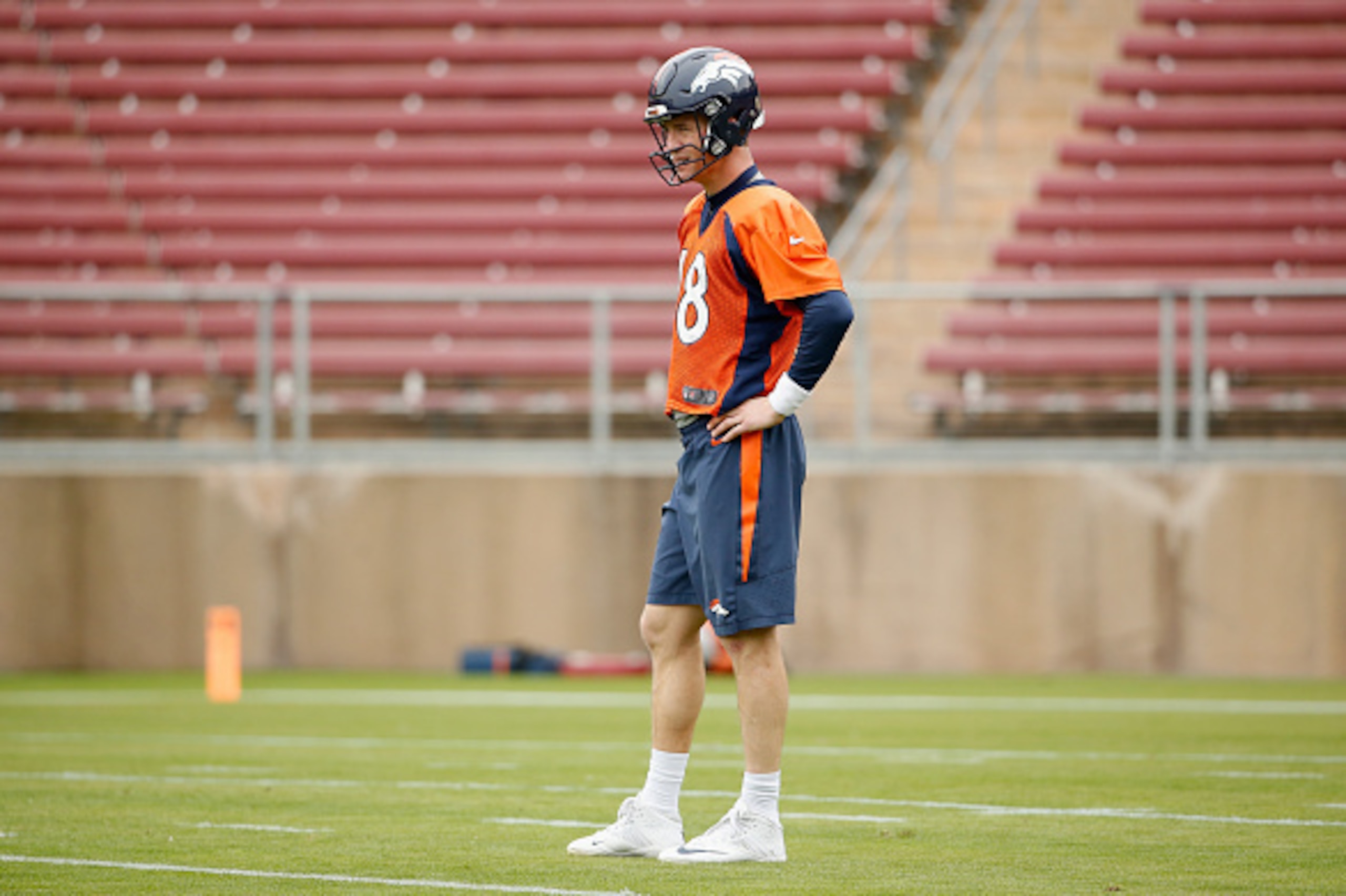 STANFORD, CA - FEBRUARY 03:  Peyton Manning #18 of the Denver Broncos stands on the field during the Broncos practice for Super Bowl 50 at Stanford University on February 3, 2016 in Stanford, California. The Broncos will play the Carolina Panthers in Supe