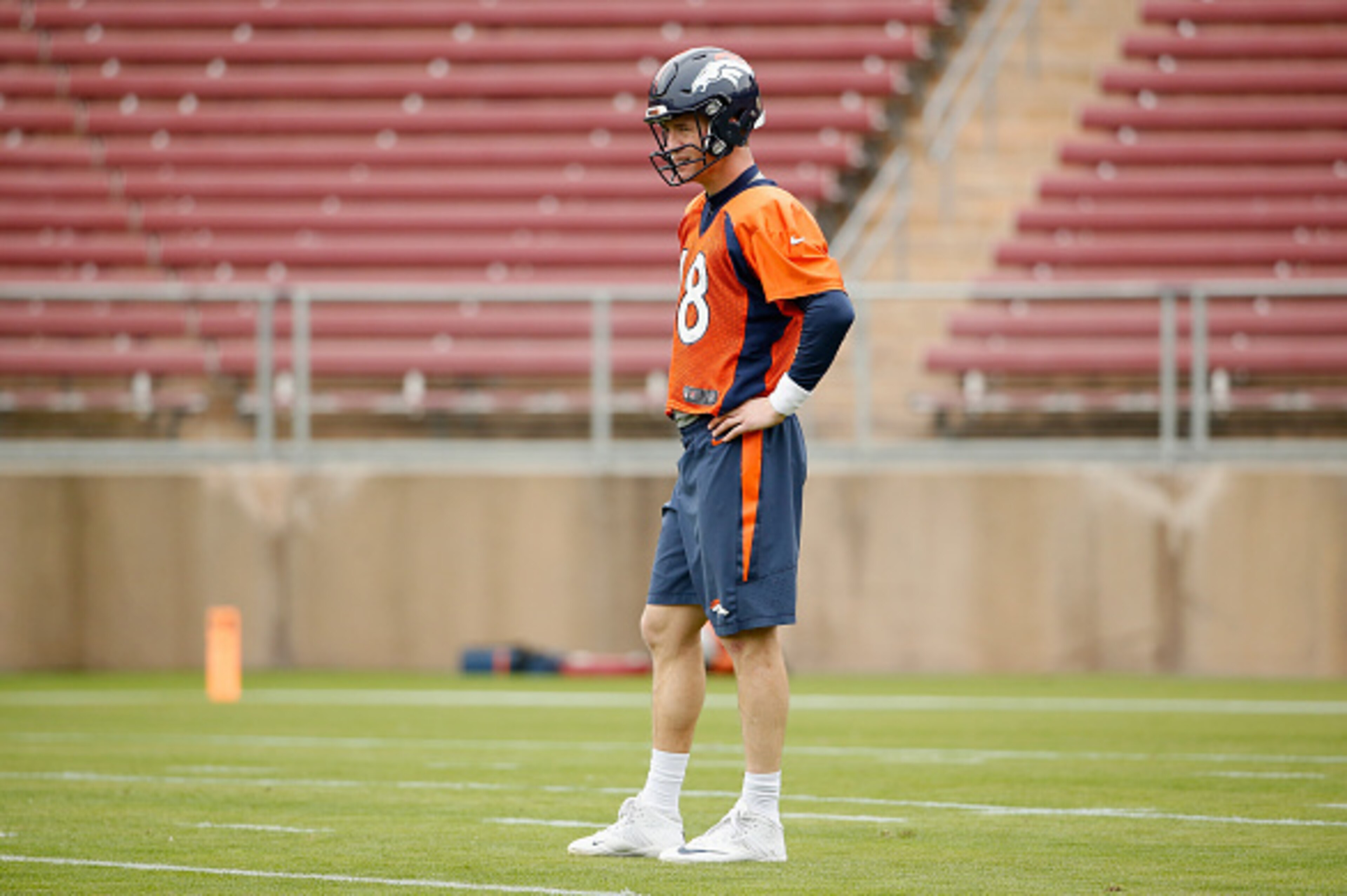 STANFORD, CA - FEBRUARY 03:  Peyton Manning #18 of the Denver Broncos stands on the field during the Broncos practice for Super Bowl 50 at Stanford University on February 3, 2016 in Stanford, California. The Broncos will play the Carolina Panthers in Supe
