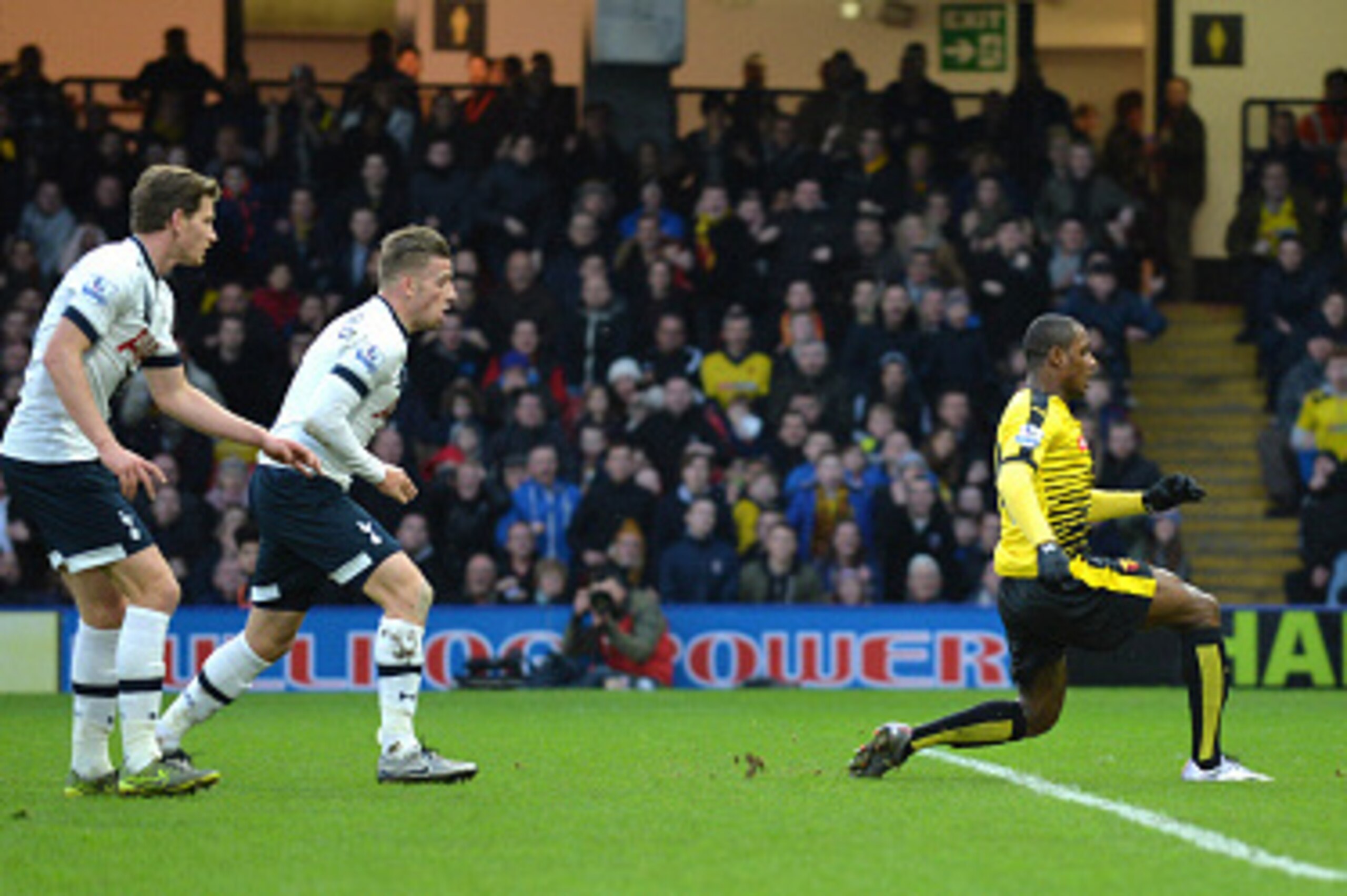 Tottenham Hotspur's Belgian defenders Jan Vertonghen and Toby Alderweireld (2nd L) look on as Watford's Nigerian striker Odion Ighalo (2nd R) shoots past Tottenham Hotspur's French goalkeeper Hugo Lloris (R) to score their first goal during the English Pr