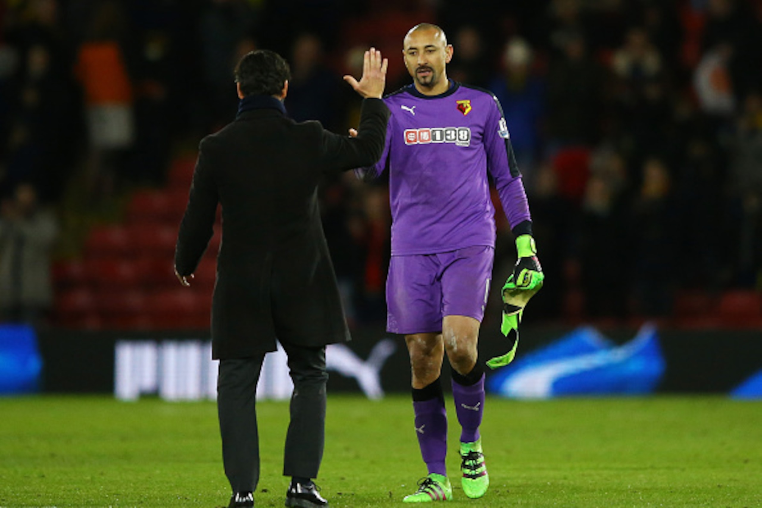 WATFORD, ENGLAND - FEBRUARY 03:  Quique Flores the manager of Watford and Goalkeeper Heurelho Gomes of Watford celebrate following the 0-0 draw during the Barclays Premier League match between Watford and Chelsea at Vicarage Road on February 3, 2016 in Wa