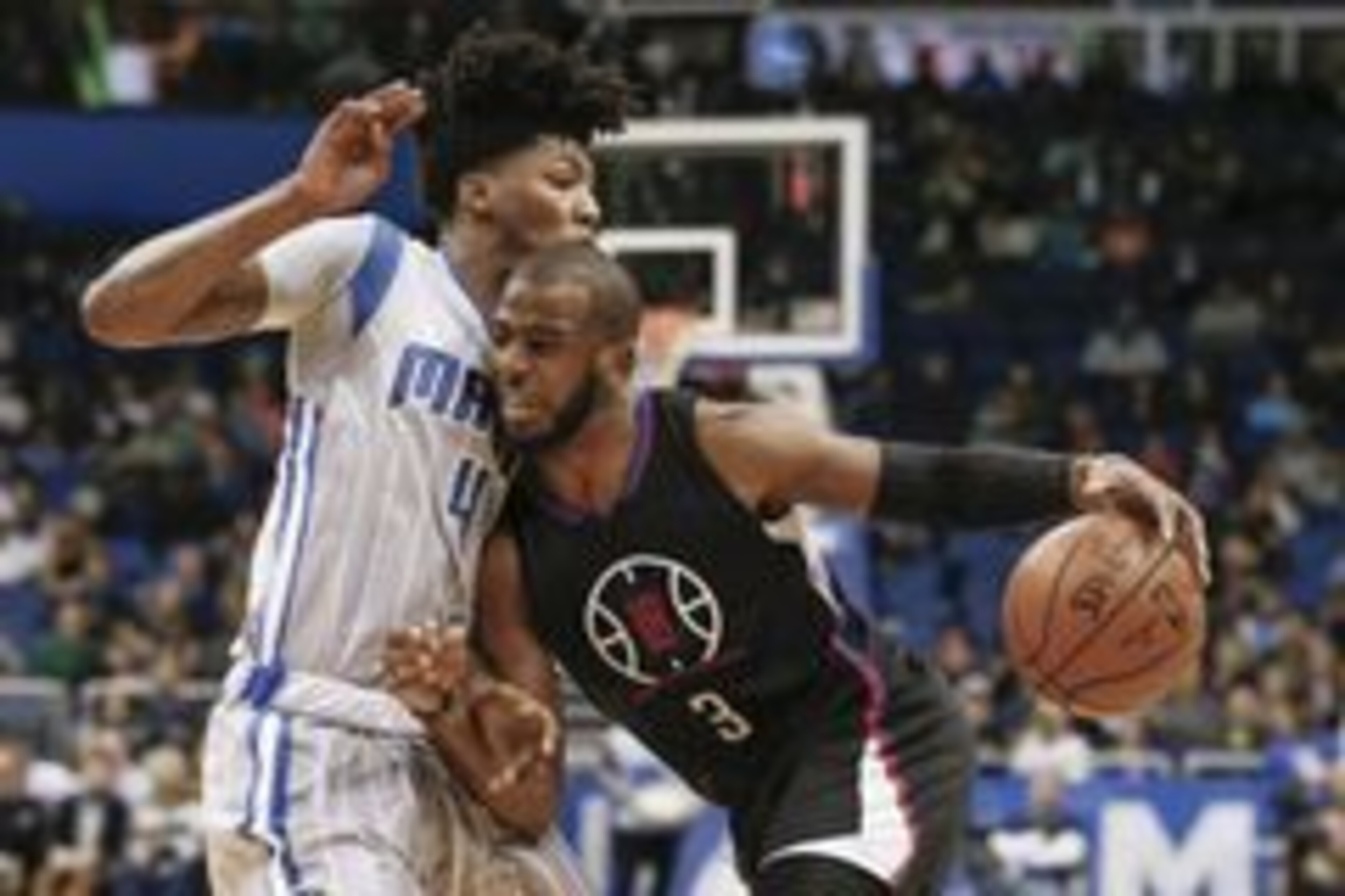 Feb 5, 2016; Orlando, FL, USA; Orlando Magic guard Elfrid Payton (4) defends against the drive from Los Angeles Clippers guard Chris Paul (3) during the first quarter of a basketball game at Amway Center. Mandatory Credit: Reinhold Matay-USA TODAY Sports Feb 5, 2016; Orlando, FL, USA; Orlando Magic guard Elfrid Payton (4) defends against the drive from Los Angeles Clippers guard Chris Paul (3) during the first quarter of a basketball game at Amway Center. Mandatory Credit: Reinhold Matay-USA TODAY Sports