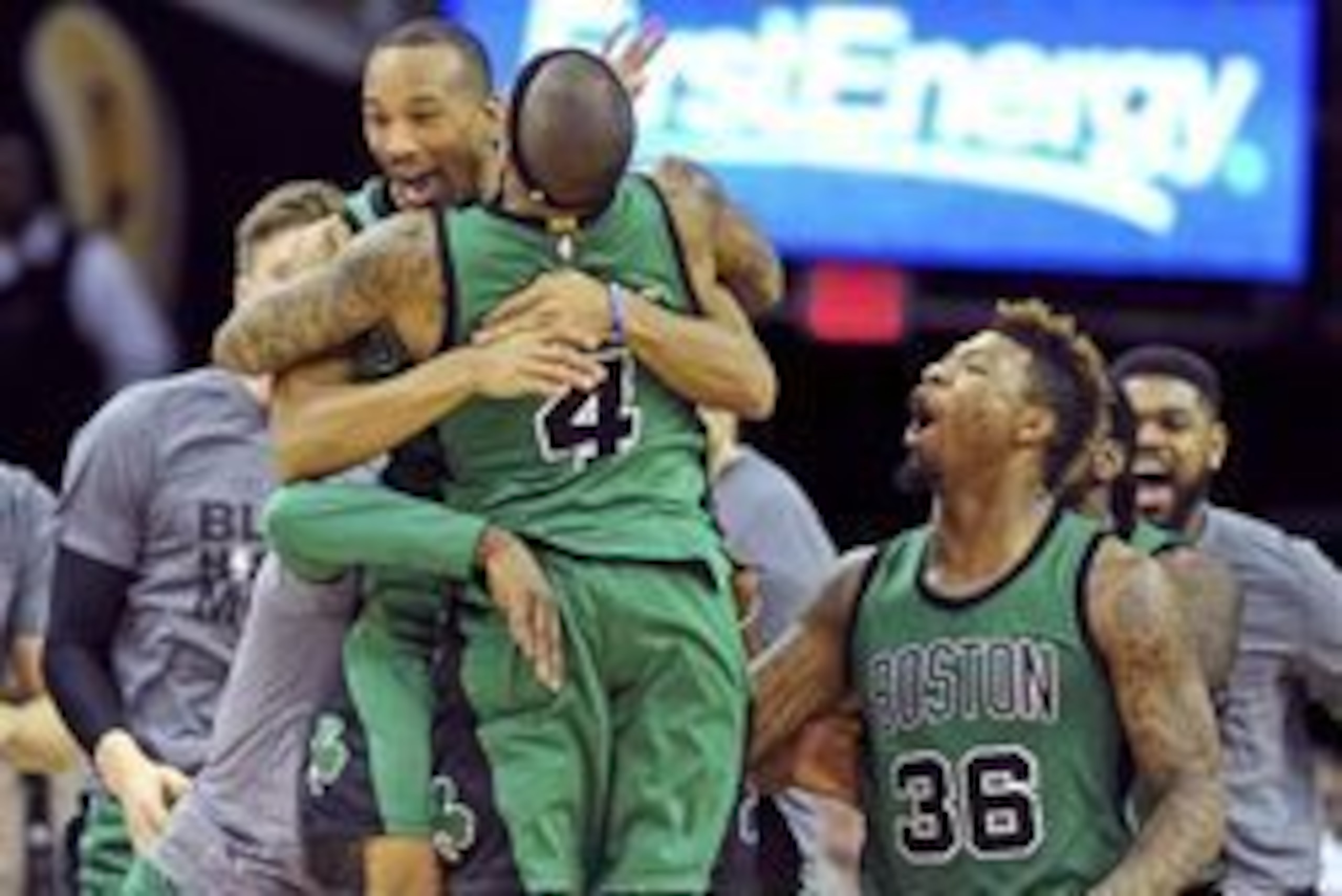 Feb 5, 2016; Cleveland, OH, USA; Boston Celtics guard Avery Bradley (0) celebrates with guard Isaiah Thomas (4) after making a three-point shot to end the game and beat the Cleveland Cavaliers at Quicken Loans Arena. The Celtics won 104-103. Mandatory Cre
