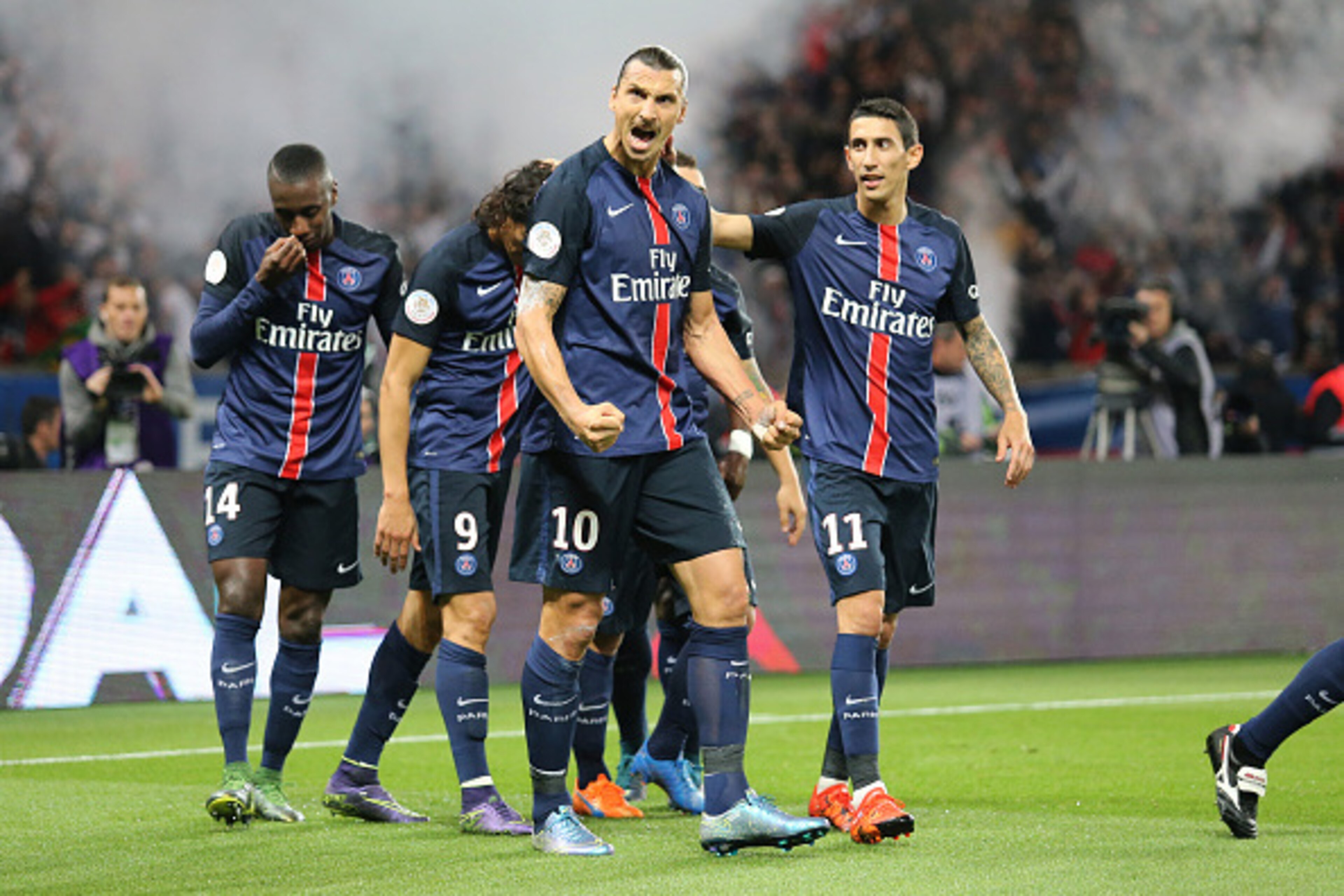 PARIS, FRANCE - OCTOBER 4: Zlatan Ibrahimovic of PSG (left) celebrates his goal with Angel Di Maria of PSG during the French Ligue 1 match between Paris Saint-Germain FC (PSG) and Olympique de Marseille at Parc des Princes stadium on October 4, 2015 in Pa