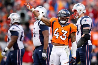 DENVER, CO - JANUARY 24:  T.J. Ward #43 of the Denver Broncos gestures after a play in the first half against the New England Patriots in the AFC Championship game at Sports Authority Field at Mile High on January 24, 2016 in Denver, Colorado.  (Photo by 
