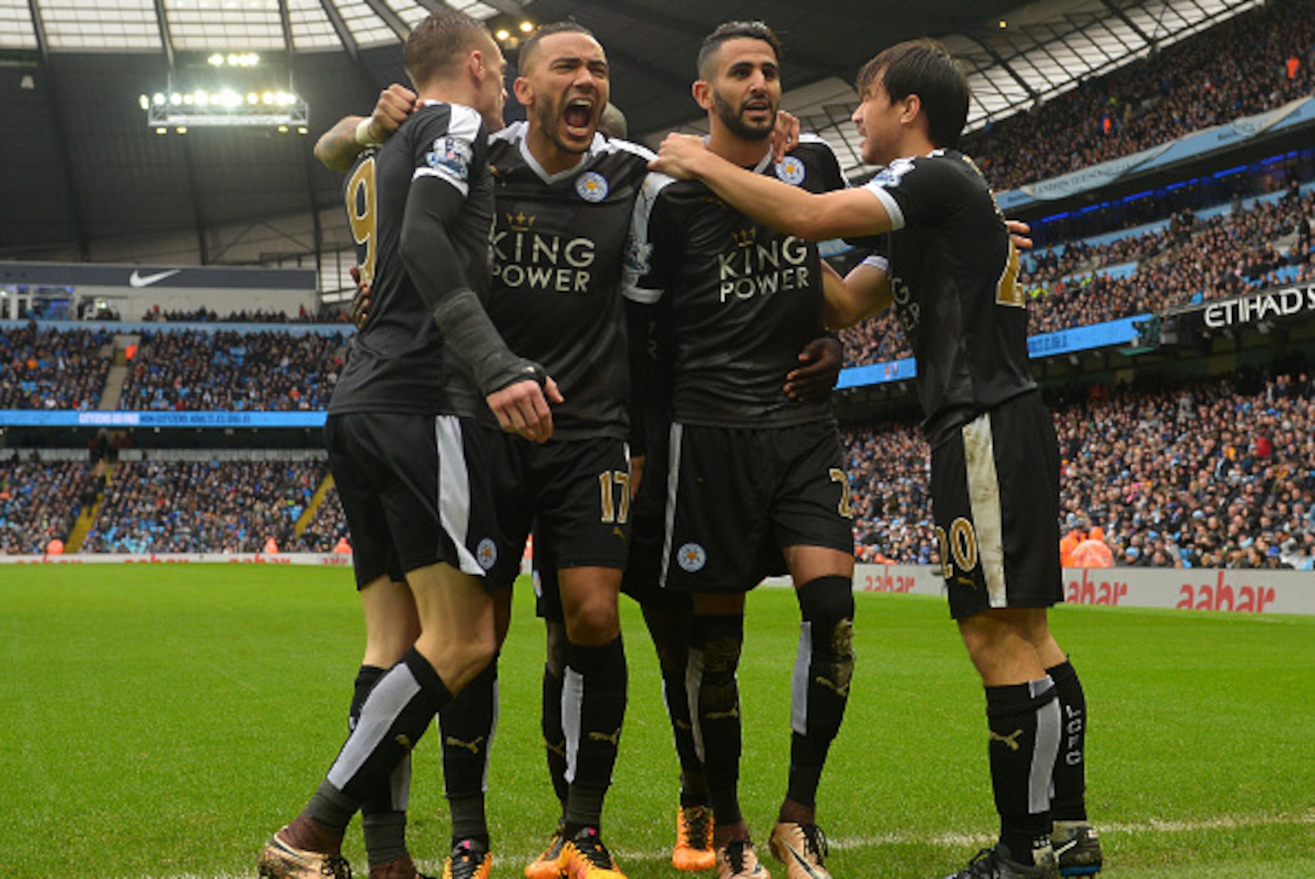 MANCHESTER, ENGLAND - FEBRUARY 06:  Riyad Mahrez (2nd R) of Leicester City celebrates scoring his team's second goal with his team mates Shinji Okazaki (1st R), Danny Simpson (2nd L) and Jamie Vardy (1st L) during the Barclays Premier League match between