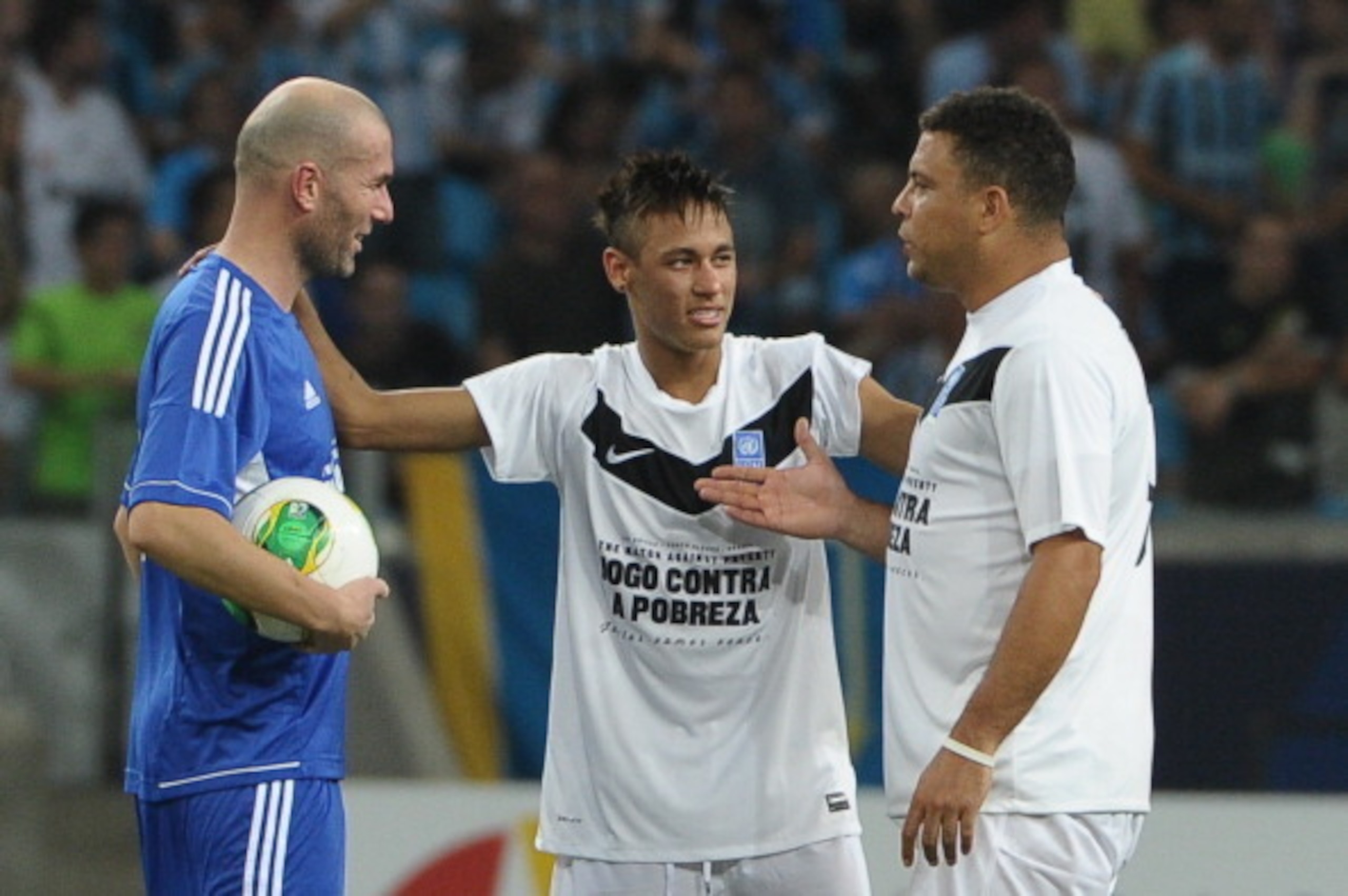Brazilian football players Neymar (C) and Ronaldo (R) and French football player Zidane speaks before the second half during the 'Match Against Poverty' friendly football match led by the United Nations Development Programme (UNDP), between the teams 'Fri Brazilian football players Neymar (C) and Ronaldo (R) and French football player Zidane speaks before the second half during the 'Match Against Poverty' friendly football match led by the United Nations Development Programme (UNDP), between the teams 'Fri