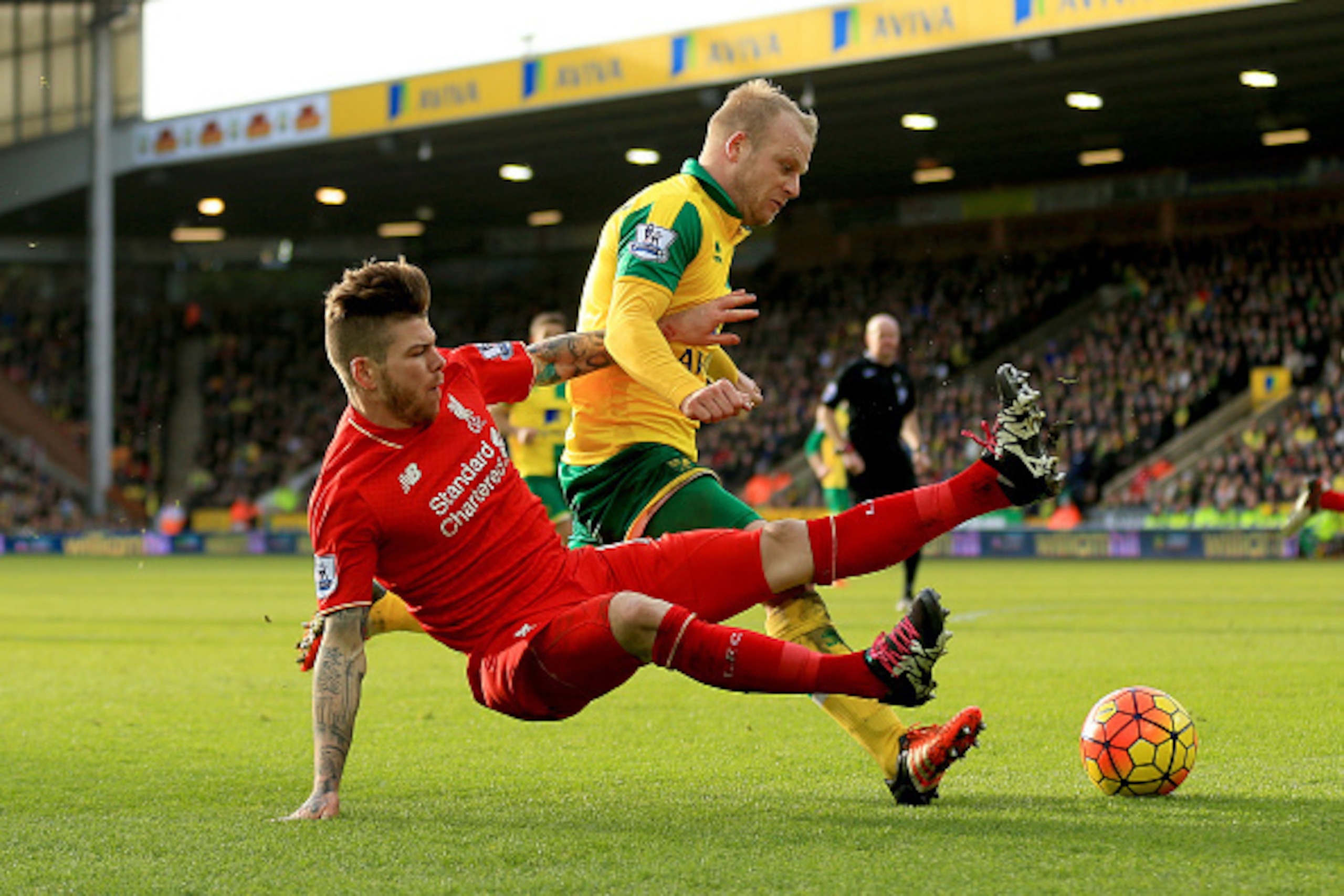 NORWICH, ENGLAND - JANUARY 23:  Steven Naismith of Norwich City is fouled by Alberto Moreno of Liverpool resulting in the penalty kick during the Barclays Premier League match between Norwich City and Liverpool at Carrow Road on January 23, 2016 in Norwic