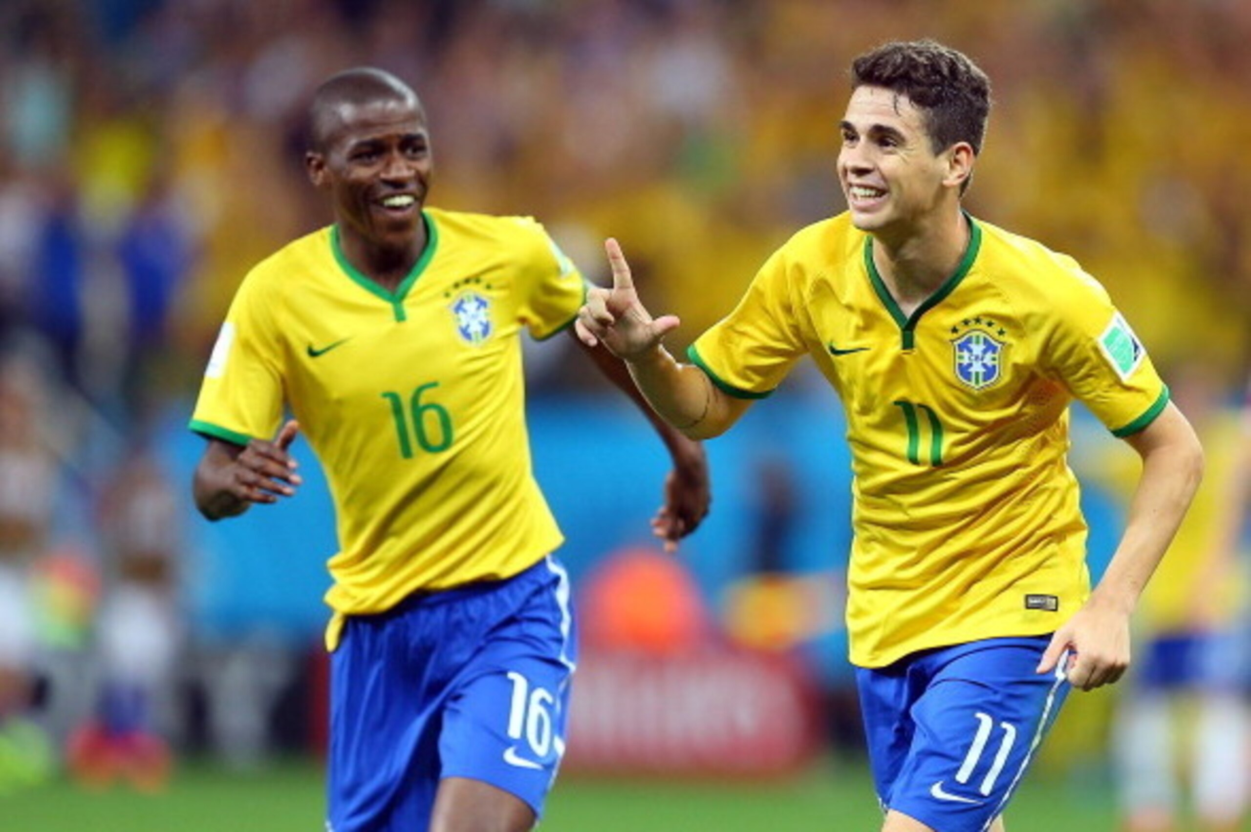 SAO PAULO, BRAZIL - JUNE 12: Oscar and Ramires of Brazil in celebrat during the 2014 FIFA World Cup Brazil Group A match between Brazil and Croatia at Arena de Sao Paulo on June 12, 2014 in Sao Paulo, Brazil. (Photo by Amin Mohammad Jamali/Getty Images)