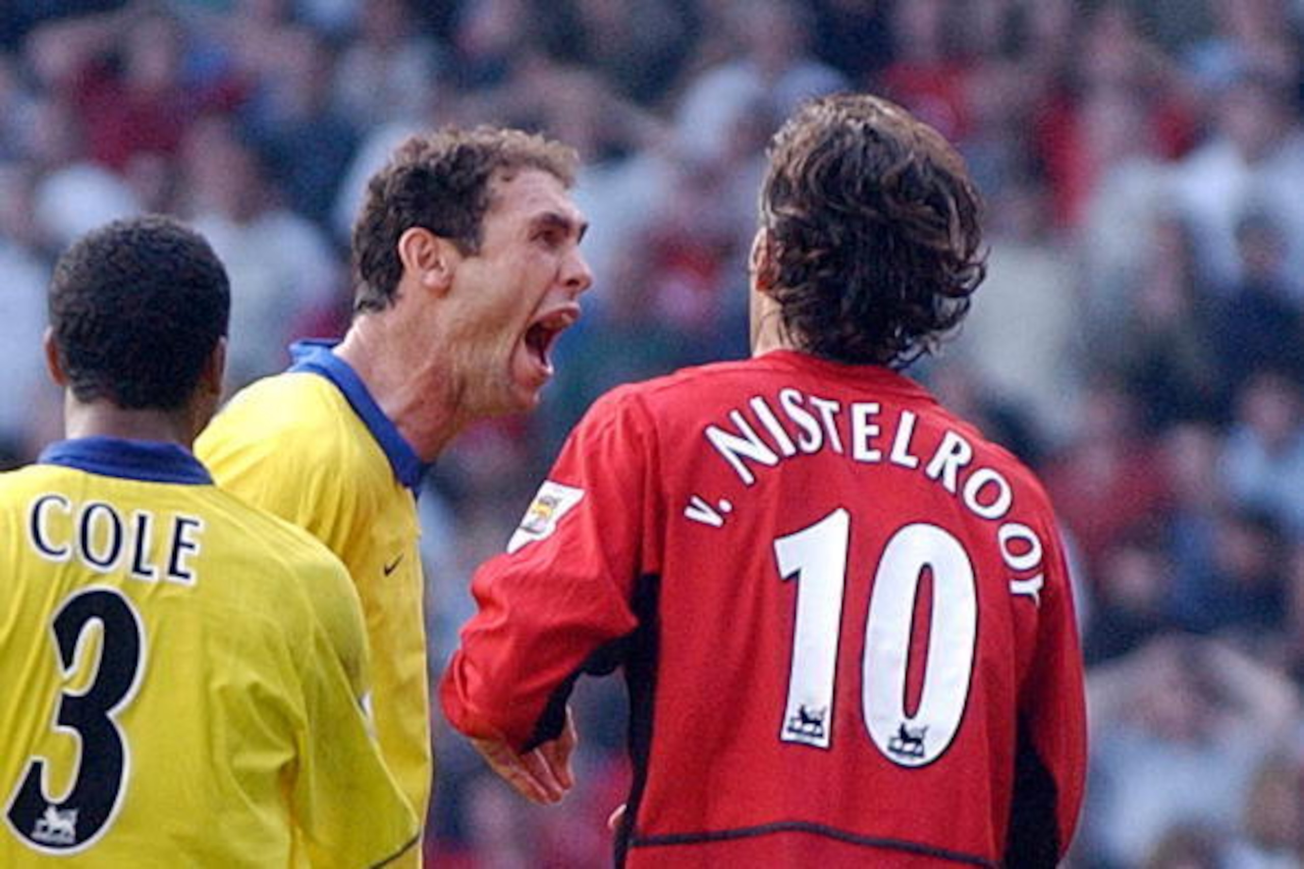 Arsenal's Martin Keown taunts Manchester United's Ruud Van Nistelrooy after he missed a penalty given away by Keown in the final minutes of todays Premiership clash at Old Trafford, Manchester 21 September 2003. AFP Photo by Paul Barker (Photo credit sho Arsenal's Martin Keown taunts Manchester United's Ruud Van Nistelrooy after he missed a penalty given away by Keown in the final minutes of todays Premiership clash at Old Trafford, Manchester 21 September 2003. AFP Photo by Paul Barker (Photo credit sho