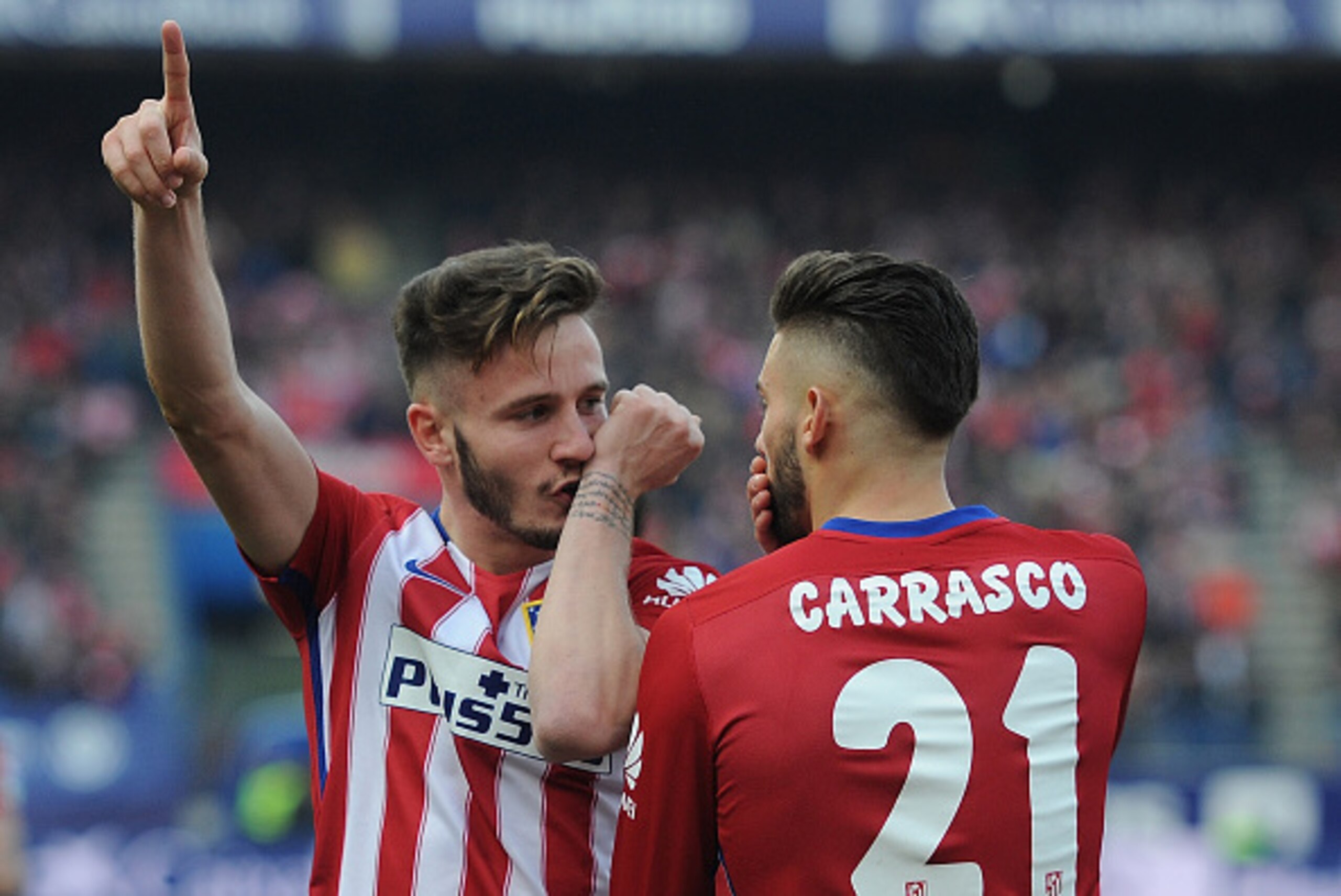 MADRID, SPAIN - FEBRUARY 06:  Saul Niguez of Club Atletico de Madrid celebrates with Yannick Carrasco after scoring his team's 2nd goal during the La Liga match between Club Atletico de Madrid and SD Eibar at Vicente Calderon Stadium on February 6, 2016 i