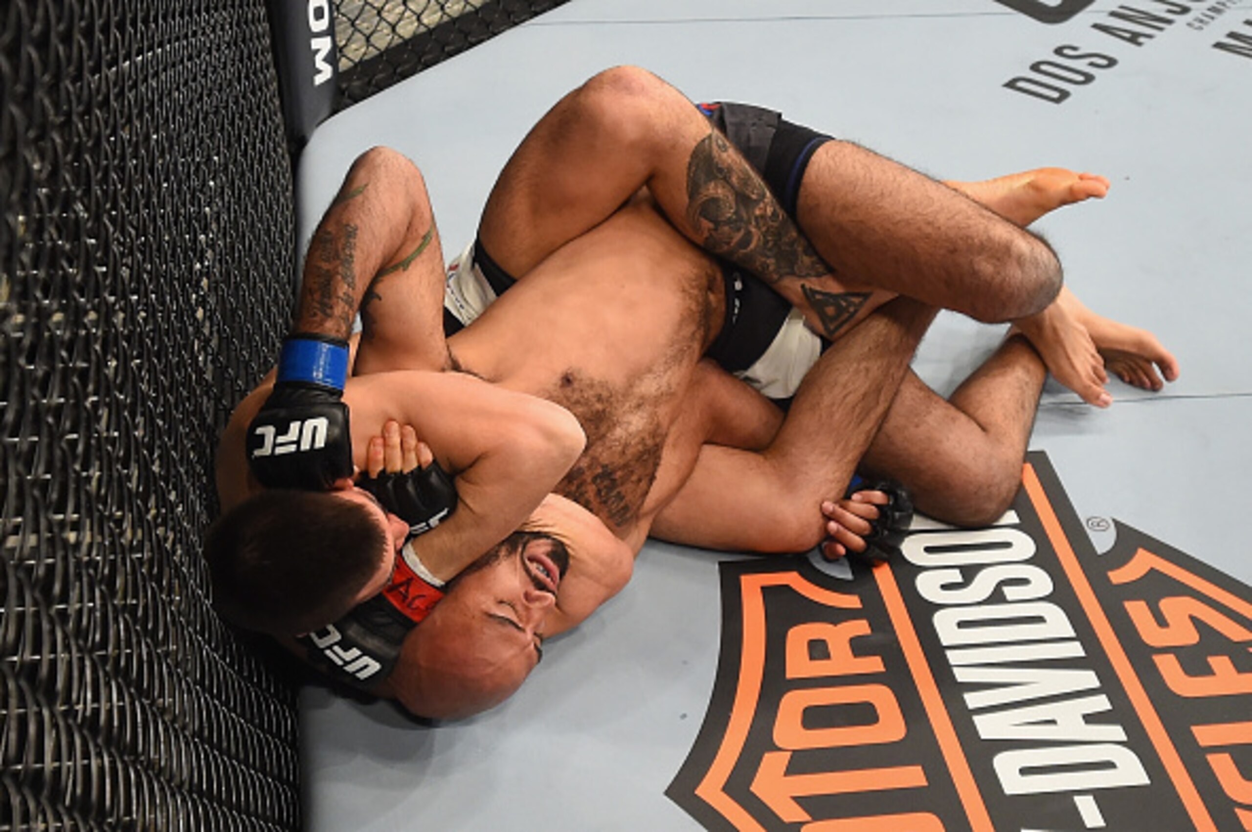 LAS VEGAS, NV - FEBRUARY 06:  (L-R) Mickey Gall secures a rear choke submission against Mike Jackson in their welterweight bout during the UFC Fight Night event at MGM Grand Garden Arena on February 6, 2016 in Las Vegas, Nevada.  (Photo by Jeff Bottari/Zu