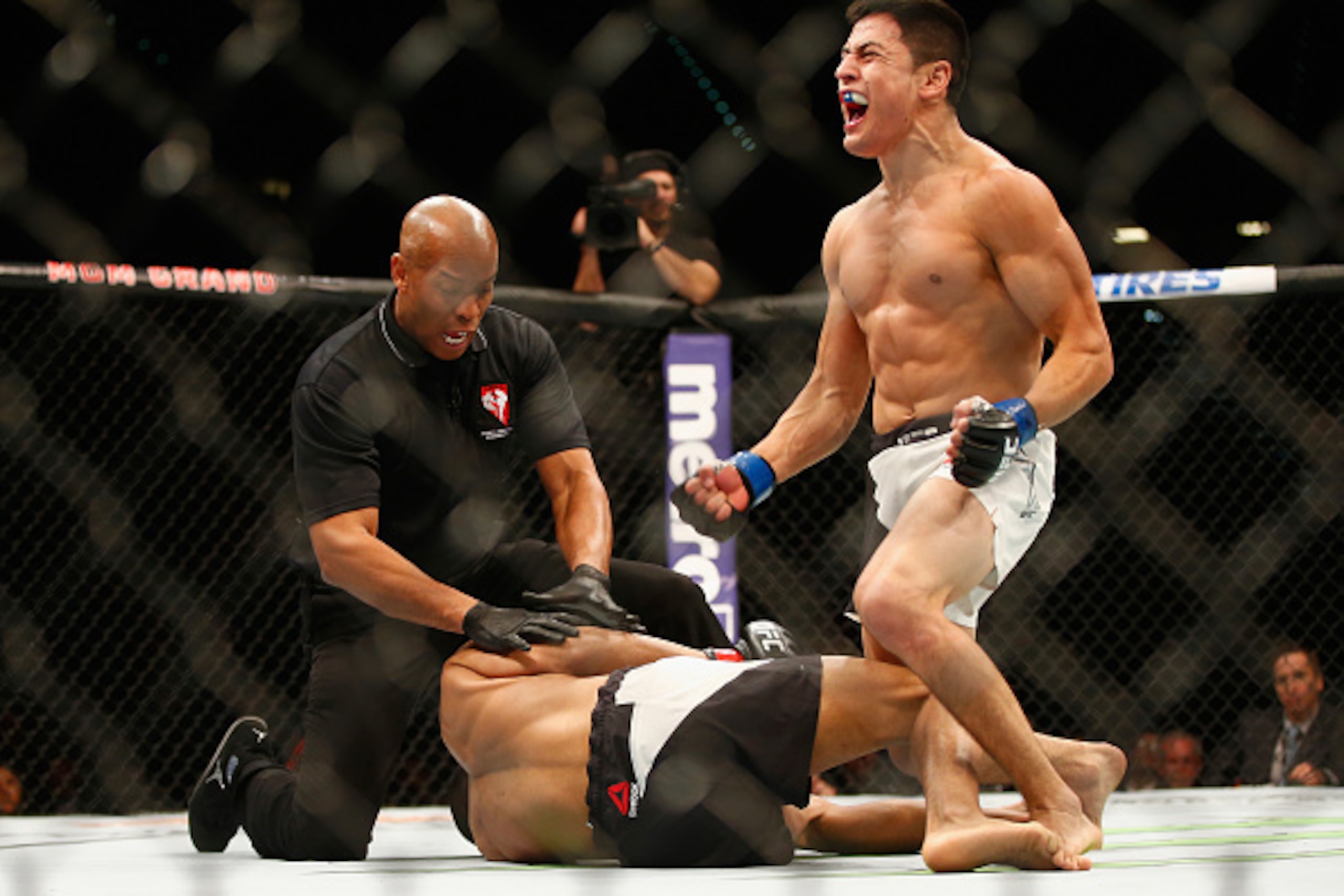 LAS VEGAS, NV - FEBRUARY 06:  Diego Rivas of Chile celebrates after his knockout victory over Noad Lahat of Israel in their featherweight bout during the UFC Fight Night event at MGM Grand Garden Arena on February 6, 2016 in Las Vegas, Nevada.  (Photo by 