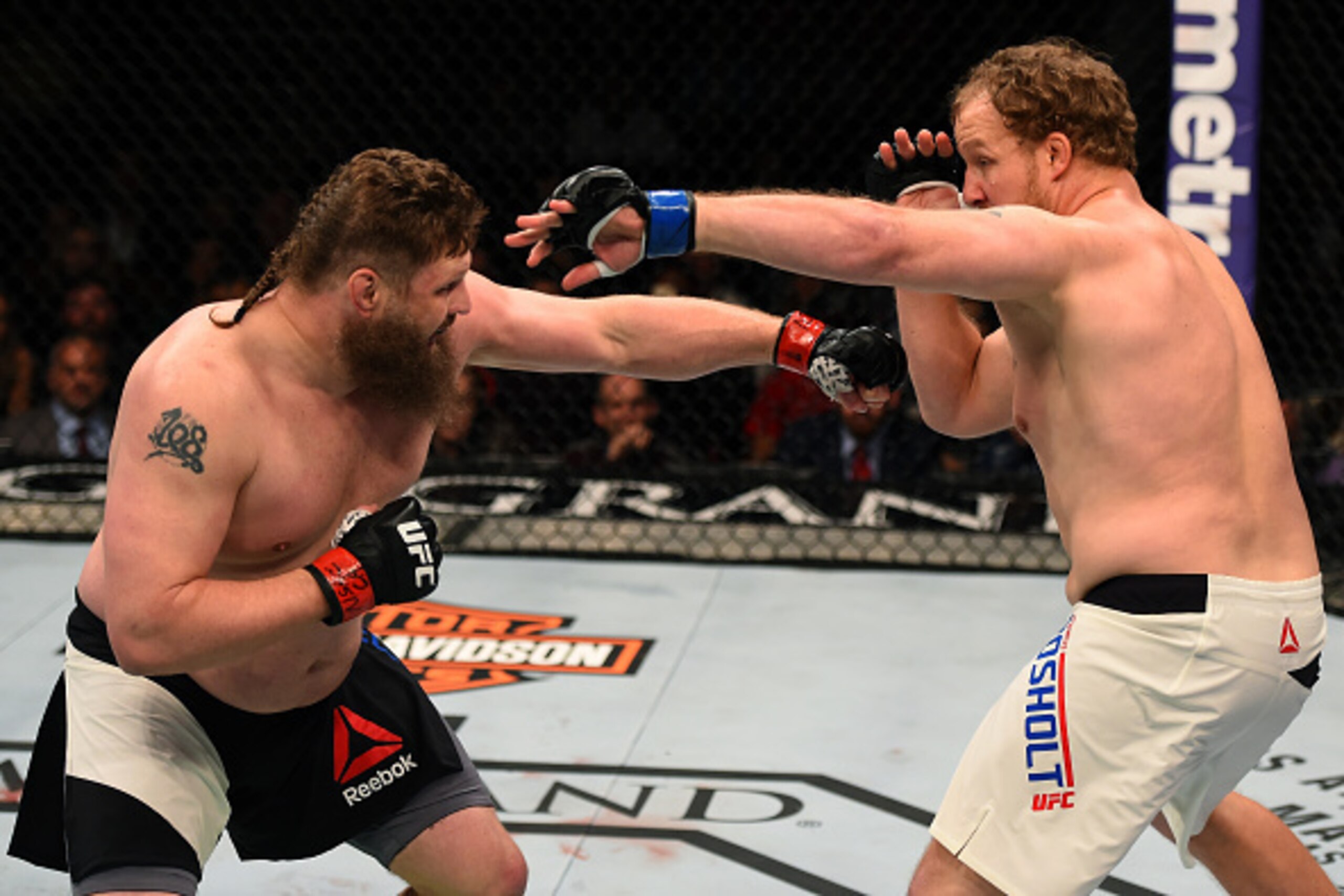 LAS VEGAS, NV - FEBRUARY 06:  (L-R) Roy Nelson fights Jared Rosholt in their heavyweight bout during the UFC Fight Night event at MGM Grand Garden Arena on February 6, 2016 in Las Vegas, Nevada.  (Photo by Josh Hedges/Zuffa LLC/Zuffa LLC via Getty Images)