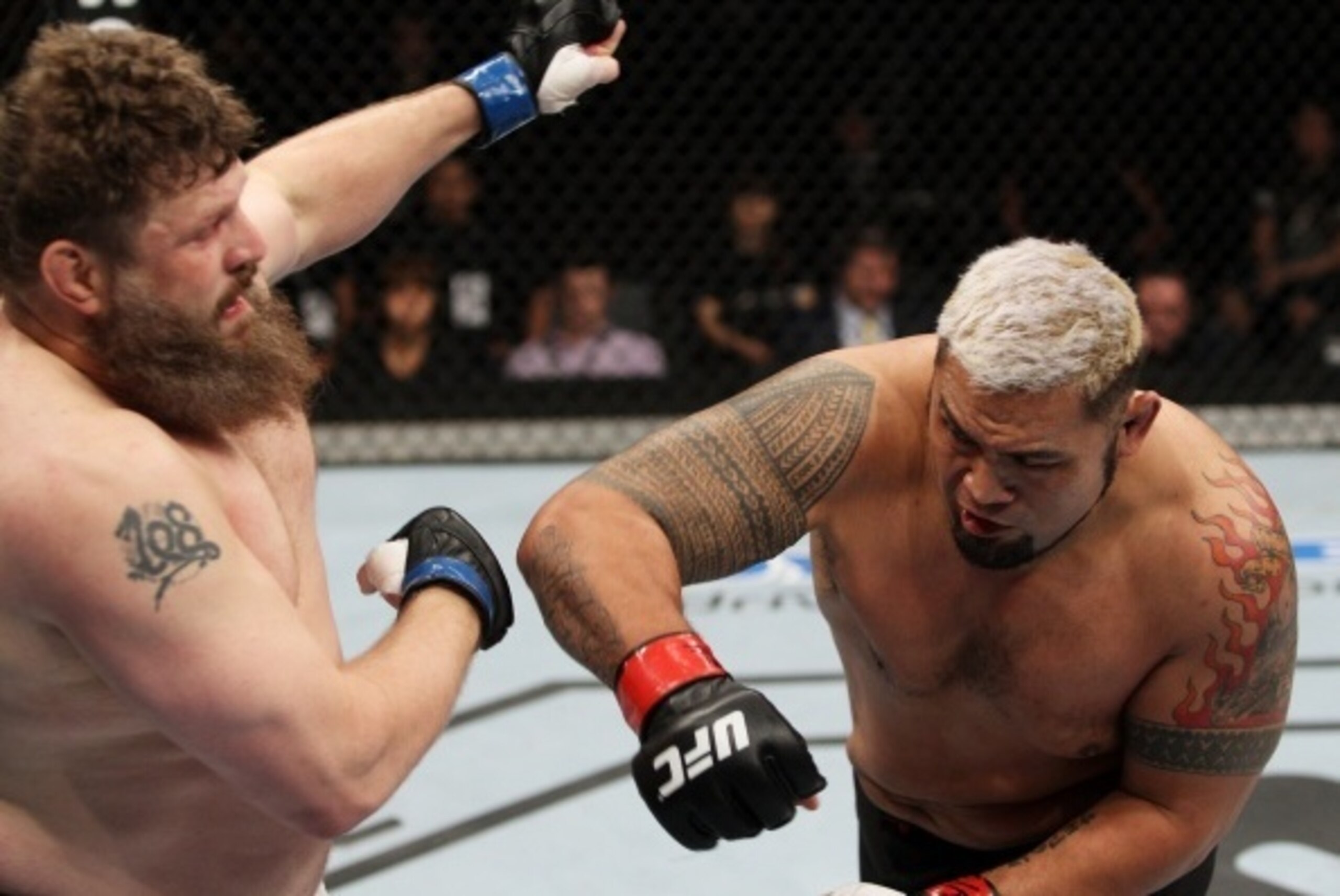 SAITAMA, JAPAN - SEPTEMBER 20:  Mark Hunt throws a punch at Roy Nelson in their heavyweight bout during the UFC Fight Night event inside the Saitama Arena on September 20, 2014 in Saitama, Japan. (Photo by Mitch Viquez/Zuffa LLC/Zuffa LLC via Getty Images