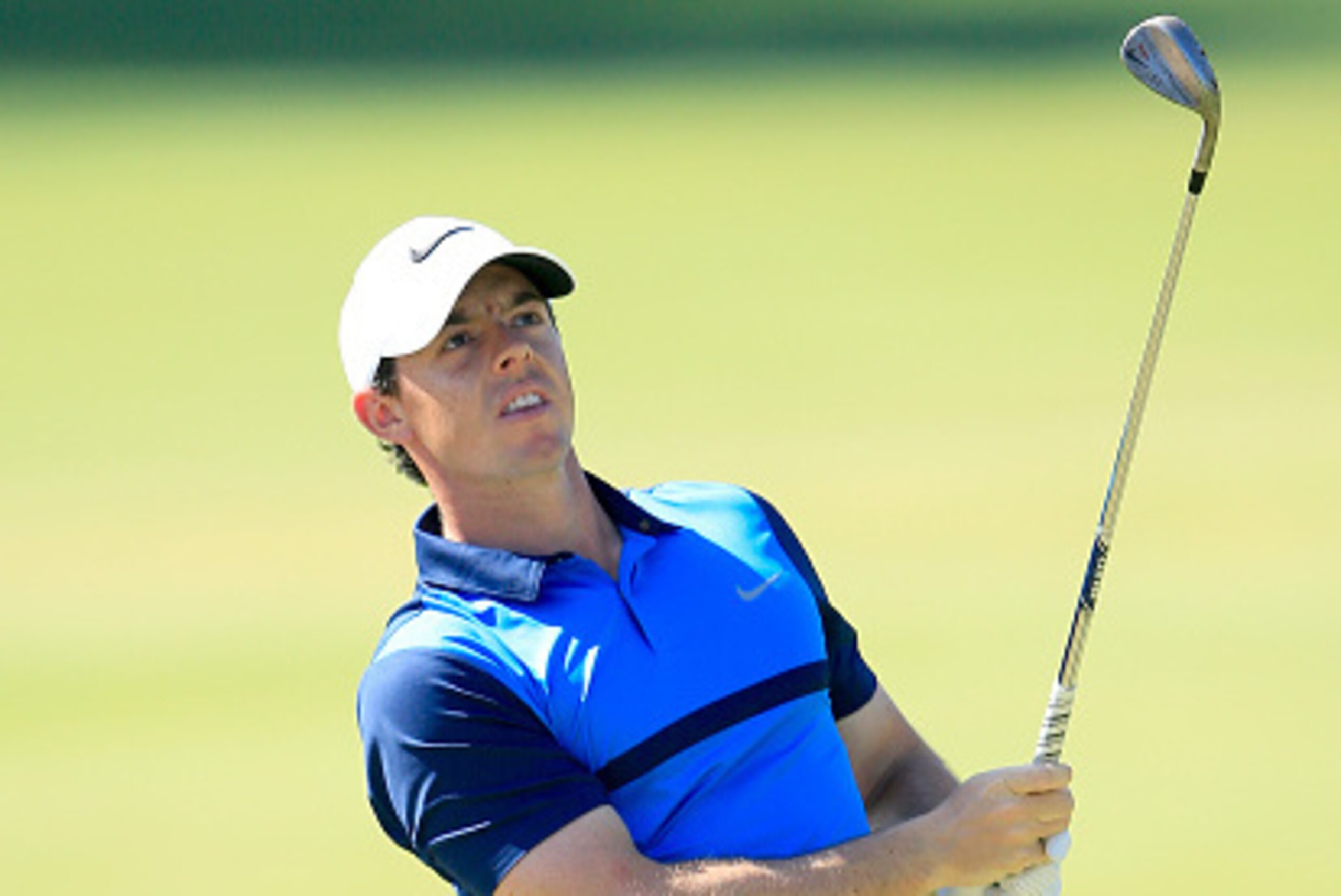DUBAI, UNITED ARAB EMIRATES - FEBRUARY 07:  Rory McIlroy of Northern Ireland plays his second shot at the par 4, first hole during the final round of the 2016 Omega Dubai Desert Classic on the Majlis Course at the Emirates Golf Club on February 7, 2016 in
