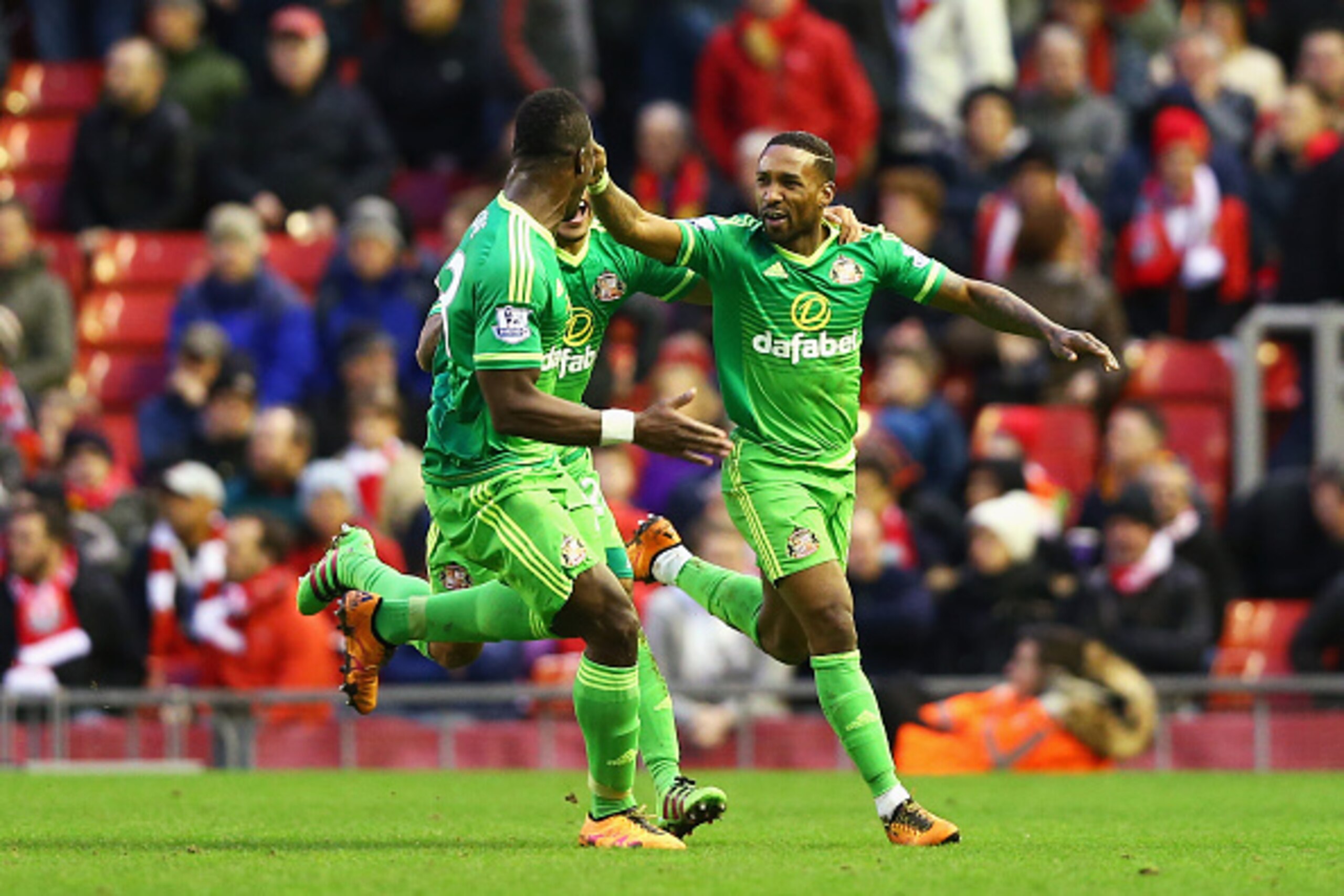 LIVERPOOL, ENGLAND - FEBRUARY 06:  Jermain Defoe (R) of Sunderland celebrates scoring his team's second goal with his team mates DeAndre Yedlin (C) and Lamine Kone (L) during the Barclays Premier League match between Liverpool and Sunderland at Anfield on