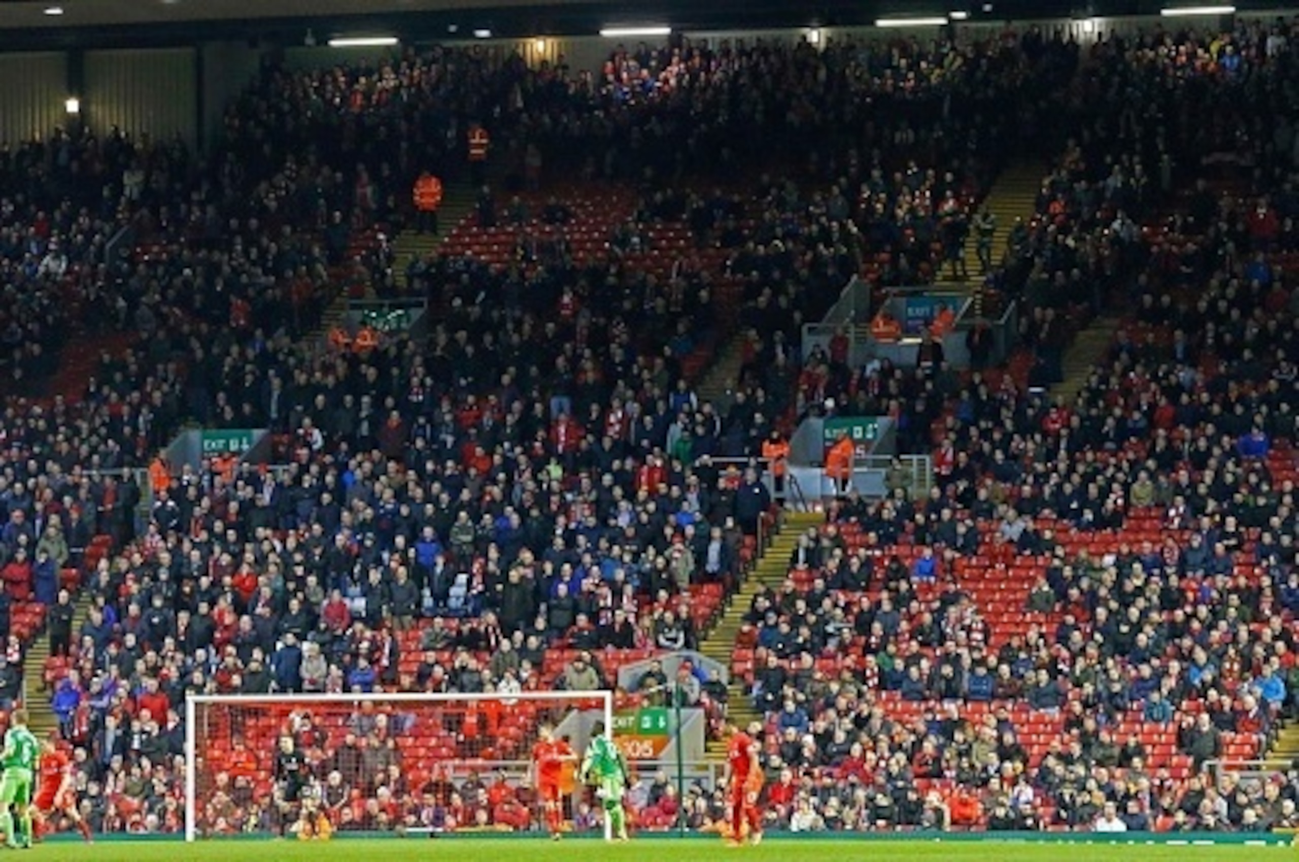 Liverpool fans leave the stands at the Kop End after 77 minutes' of play during the English Premier League football match between Liverpool and Sunderland at Anfield in Liverpool, northwest England, on February 6, 2016, in protest against the recent annou