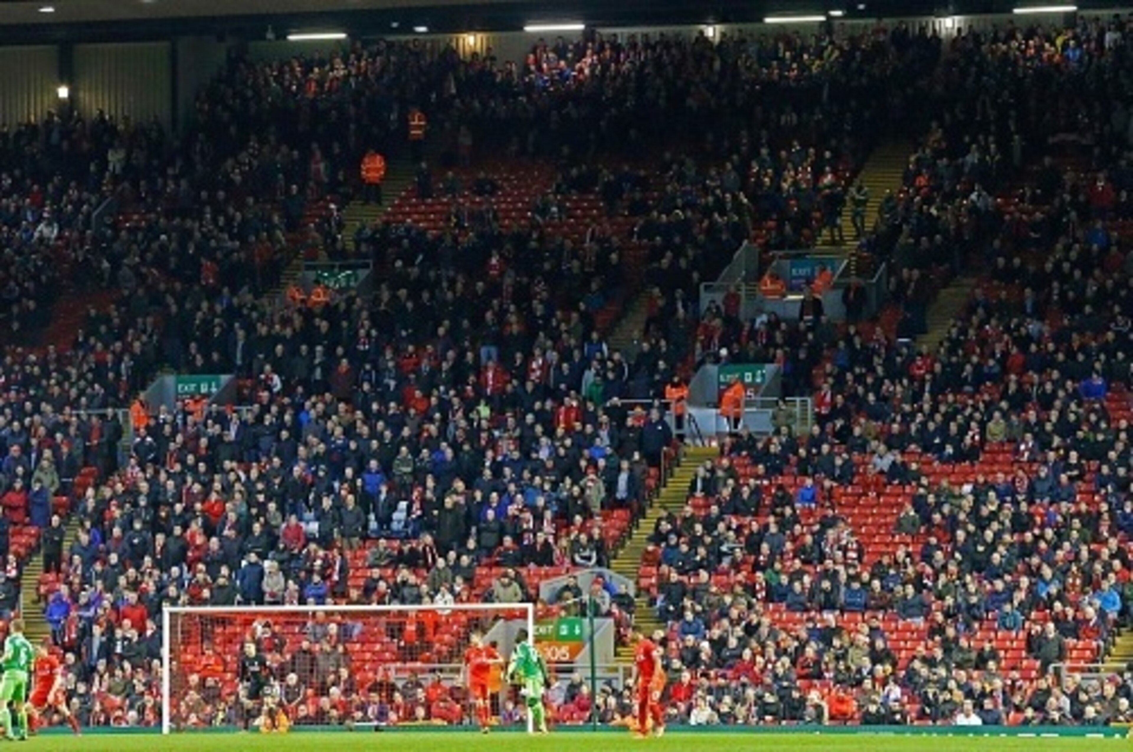 Liverpool fans leave the stands at the Kop End after 77 minutes' of play during the English Premier League football match between Liverpool and Sunderland at Anfield in Liverpool, northwest England, on February 6, 2016, in protest against the recent annou