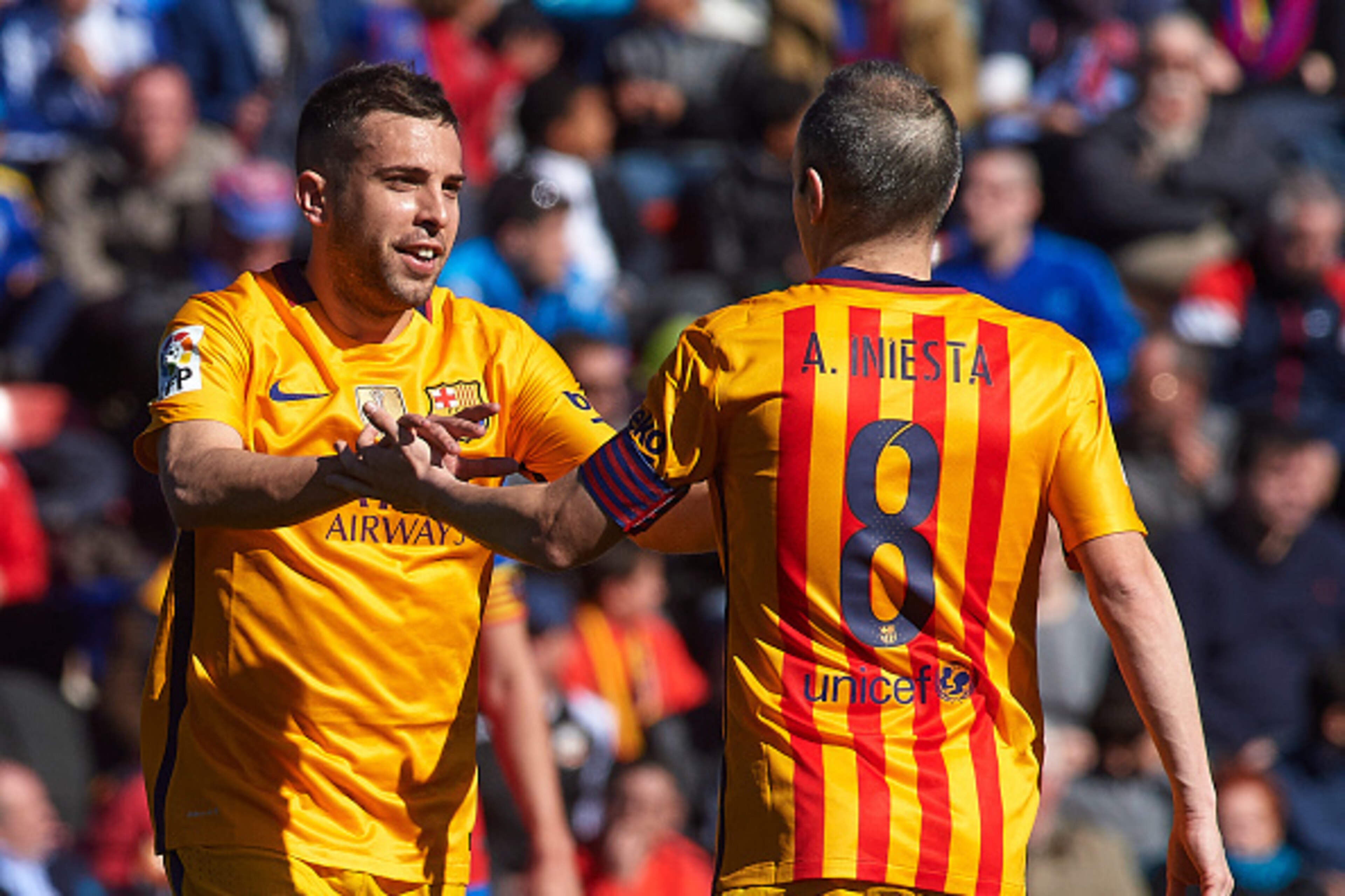 VALENCIA, SPAIN - FEBRUARY 07:  Jordi Alba of Barcelona celebrates scoring his team's first goal with his teammate Andres Iniesta during the La Liga match between Levante UD and FC Barcelona at Ciutat de Valencia on February 07, 2016 in Valencia, Spain.  