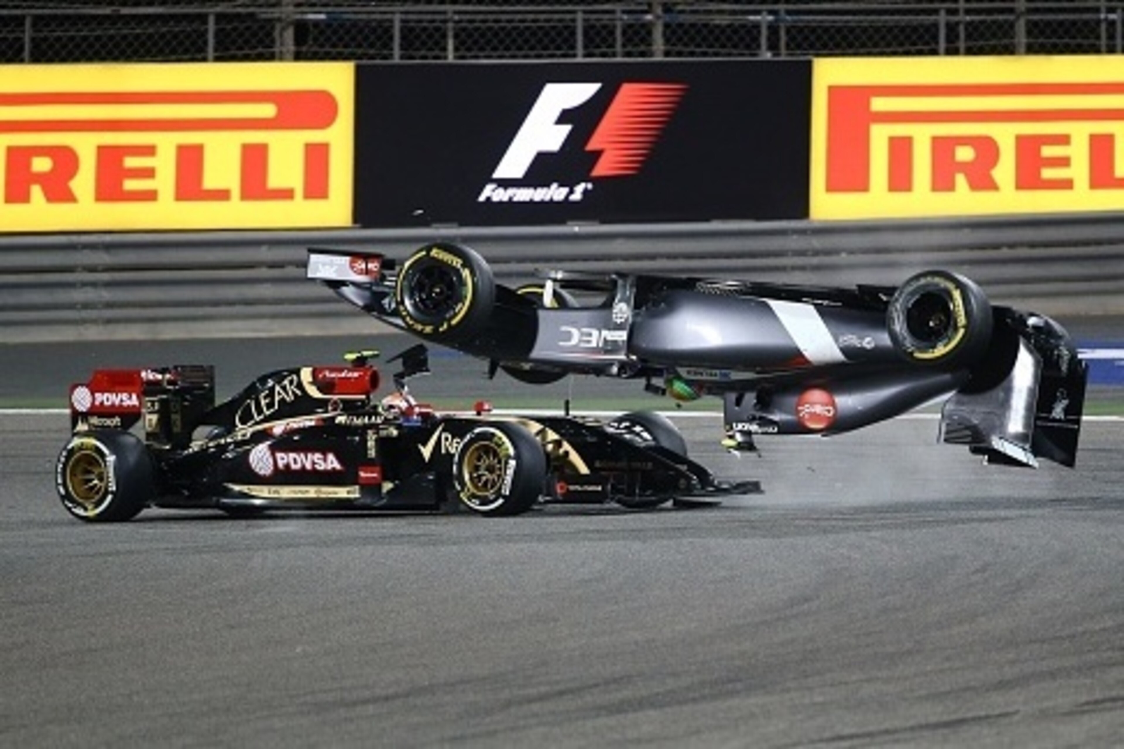 Sauber driver Esteban Gutierrez of Mexico crashes ahead of Lotus driver Pastor Maldonado of Venezuela during the Formula One Bahrain Grand Prix at Sakhir circuit in Manama on April 6, 2014. AFP PHOTO / MARWAN NAAMANI (Photo credit should read MARW Sauber driver Esteban Gutierrez of Mexico crashes ahead of Lotus driver Pastor Maldonado of Venezuela during the Formula One Bahrain Grand Prix at Sakhir circuit in Manama on April 6, 2014. AFP PHOTO / MARWAN NAAMANI (Photo credit should read MARW