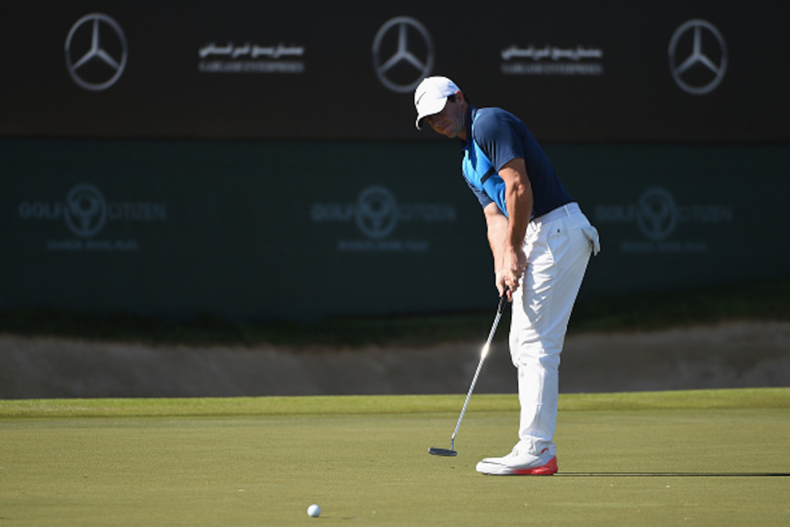 DUBAI, UNITED ARAB EMIRATES - FEBRUARY 07:  Rory McIlroy of Northern Ireland putts on the 18th green during the final round of the Omega Dubai Desert Classic at the Emirates Golf Club on February 7, 2016 in Dubai, United Arab Emirates.  (Photo by Ross Kin