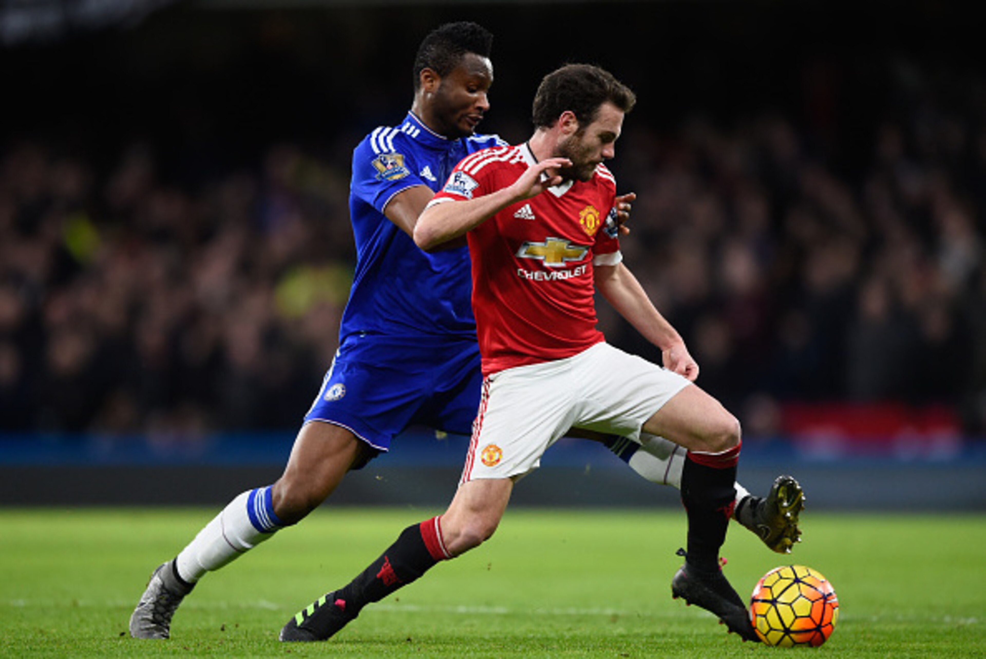 LONDON, ENGLAND - FEBRUARY 07:  John Mikel Obi of Chelsea tackles Juan Mata of Manchester United during the Barclays Premier League match between Chelsea and Manchester United at Stamford Bridge on February 7, 2016 in London, England.  (Photo by Mike Hewi
