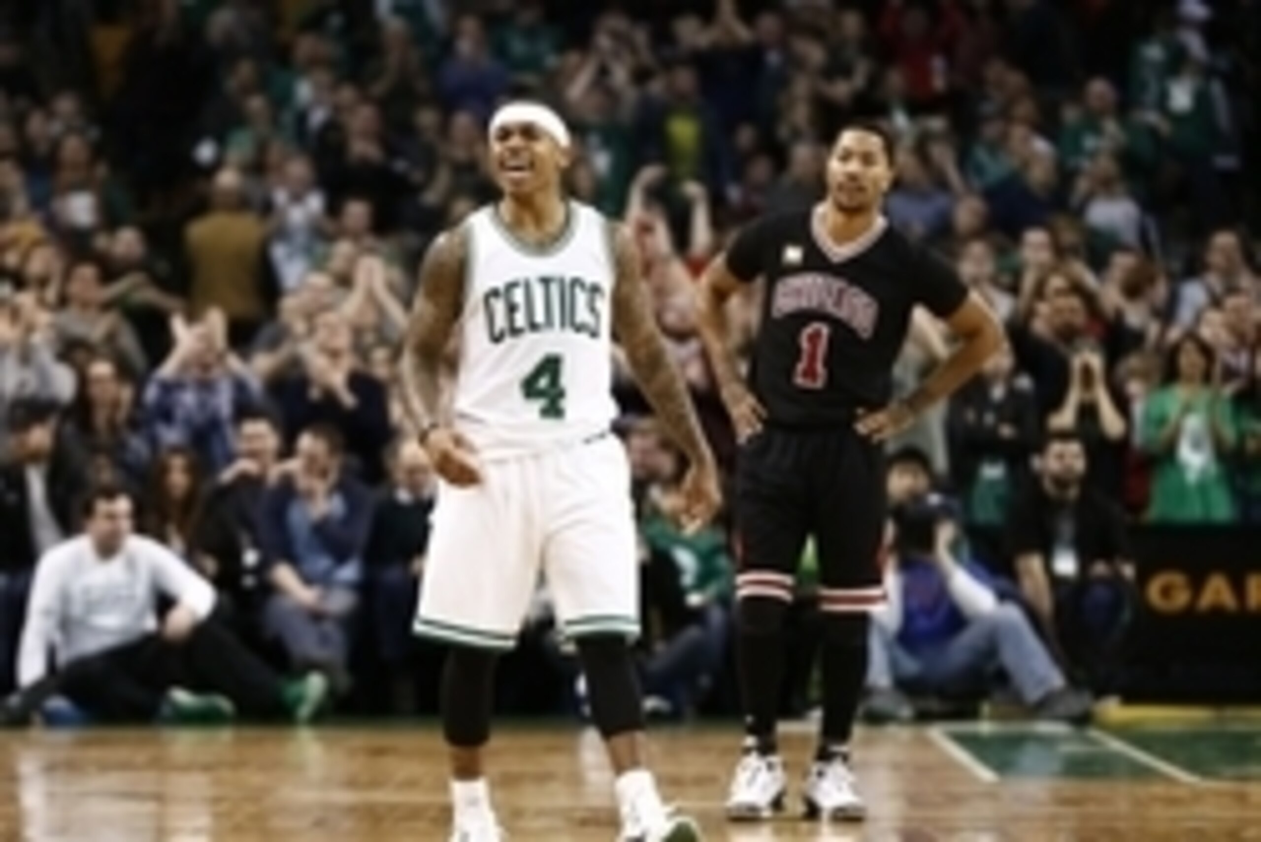 Jan 22, 2016; Boston, MA, USA; Boston Celtics guard Isaiah Thomas (4) reacts as Chicago Bulls guard Derrick Rose (1) looks on during the second half at TD Garden. Mandatory Credit: Mark L. Baer-USA TODAY Sports