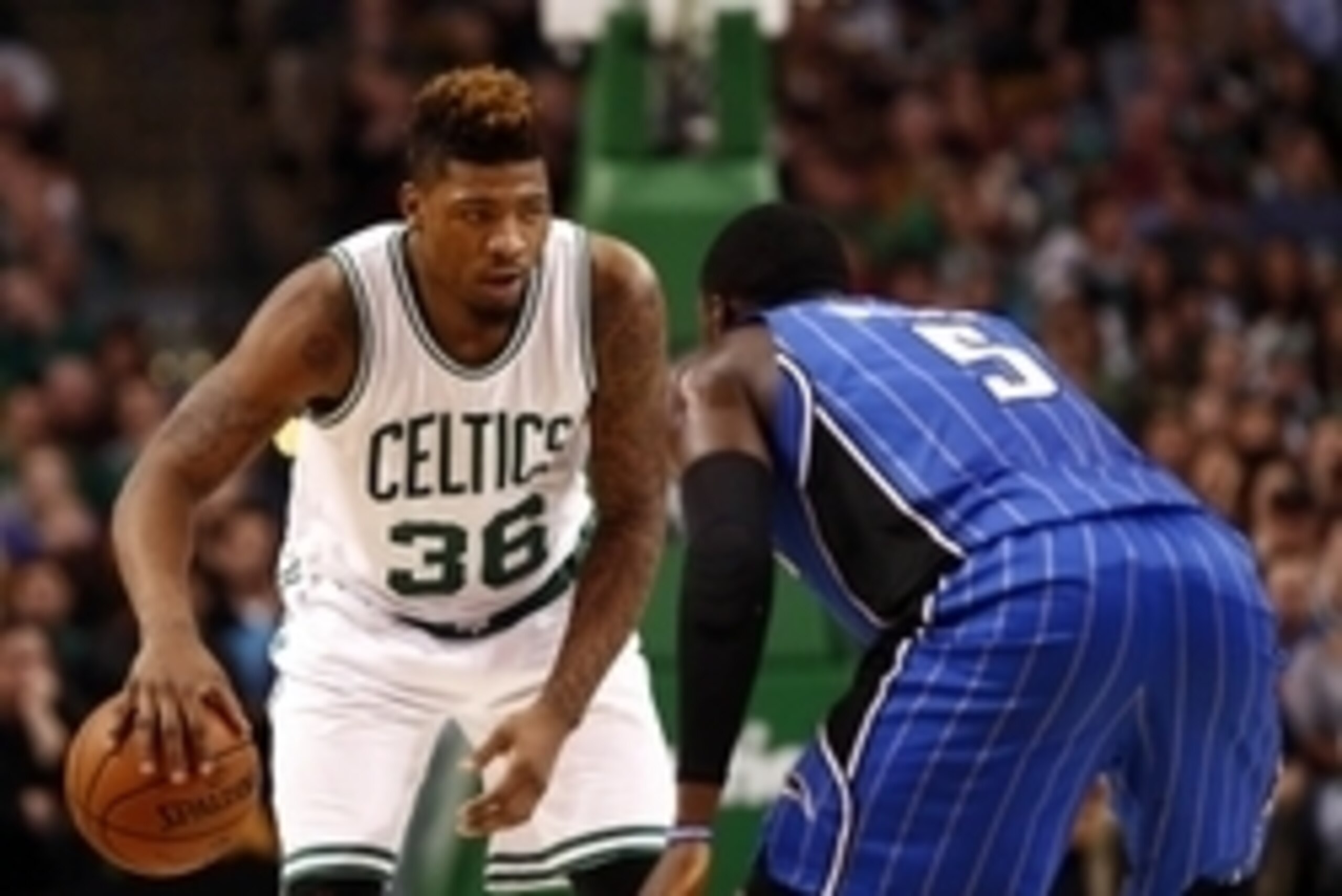 Jan 29, 2016; Boston, MA, USA; Boston Celtics guard Marcus Smart (36) dribbles the ball as Orlando Magic guard Victor Oladipo (5) defends during the second half at TD Garden. Mandatory Credit: Mark L. Baer-USA TODAY Sports
