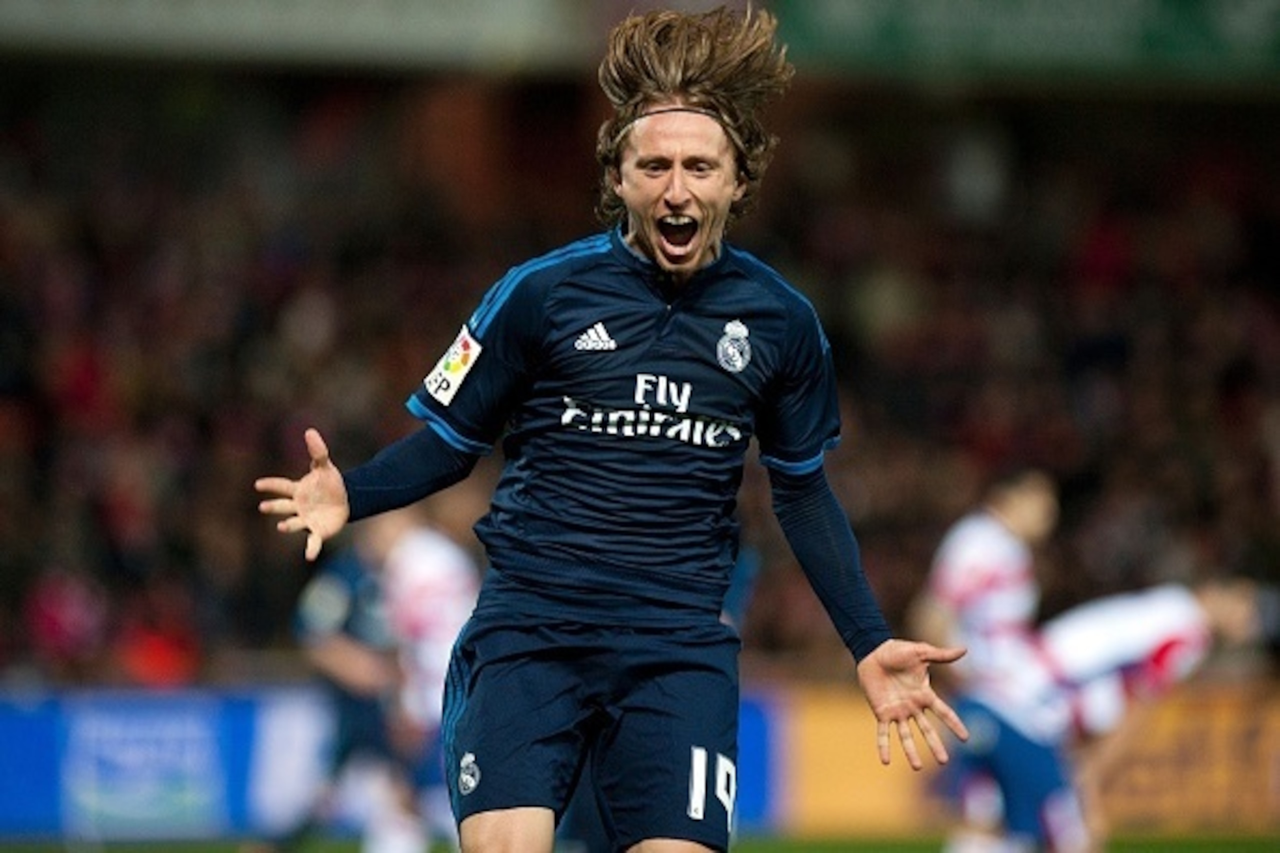 Real Madrid's Croatian midfielder Luka Modric celebrates a goal during the Spanish league football match Granada FC vs Real Madrid CF at Nuevo Los Carmenes stadium in Granada on February 7, 2016. AFP PHOTO / JORGE GUERRERO / AFP / Jorge Guerrero (P Real Madrid's Croatian midfielder Luka Modric celebrates a goal during the Spanish league football match Granada FC vs Real Madrid CF at Nuevo Los Carmenes stadium in Granada on February 7, 2016. AFP PHOTO / JORGE GUERRERO / AFP / Jorge Guerrero (P