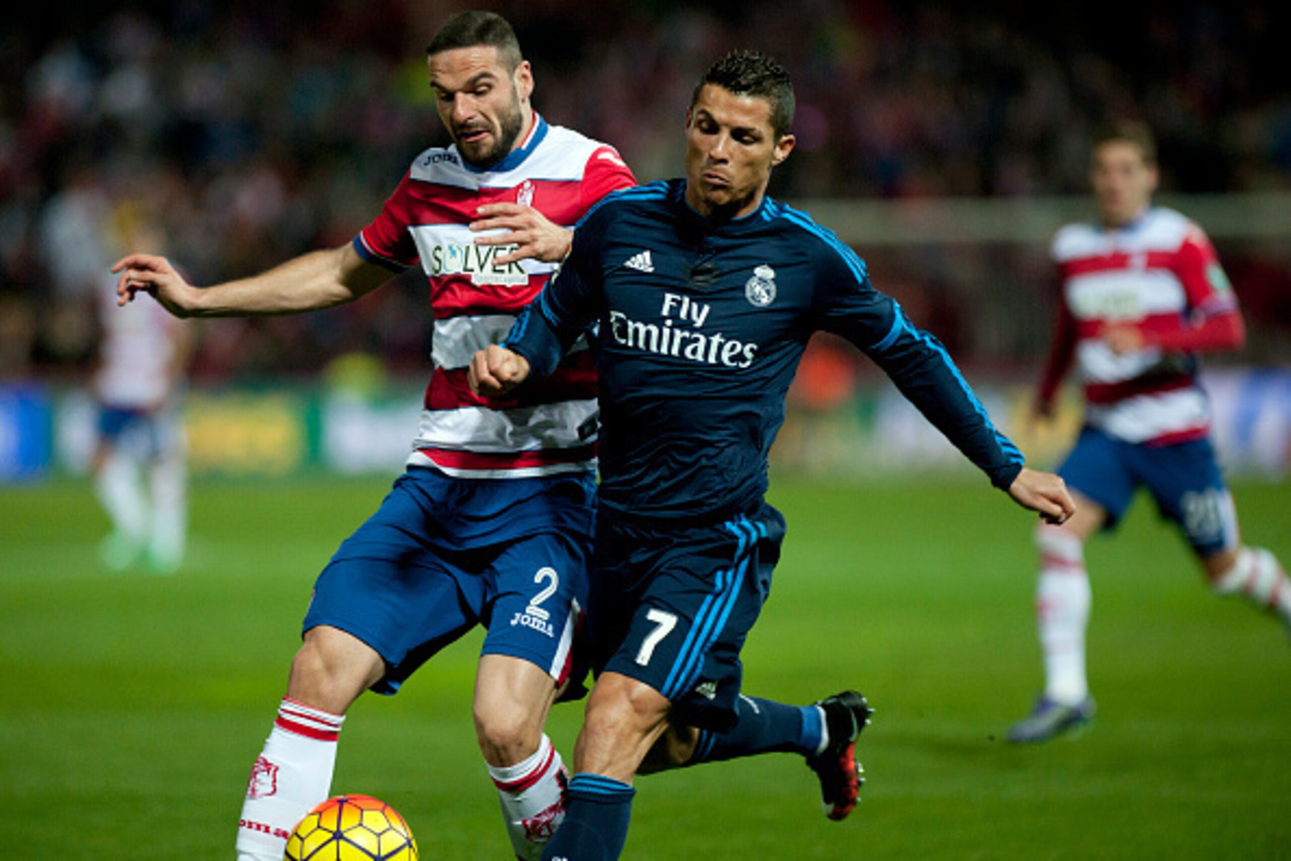 Granada's defender David Rodriguez Lomban (L) vies with Real Madrid's Portuguese forward Cristiano Ronaldo during the Spanish league football match Granada FC vs Real Madrid CF at Nuevo Los Carmenes stadium in Granada on February 7, 2016. AFP PHOTO / JORG Granada's defender David Rodriguez Lomban (L) vies with Real Madrid's Portuguese forward Cristiano Ronaldo during the Spanish league football match Granada FC vs Real Madrid CF at Nuevo Los Carmenes stadium in Granada on February 7, 2016. AFP PHOTO / JORG