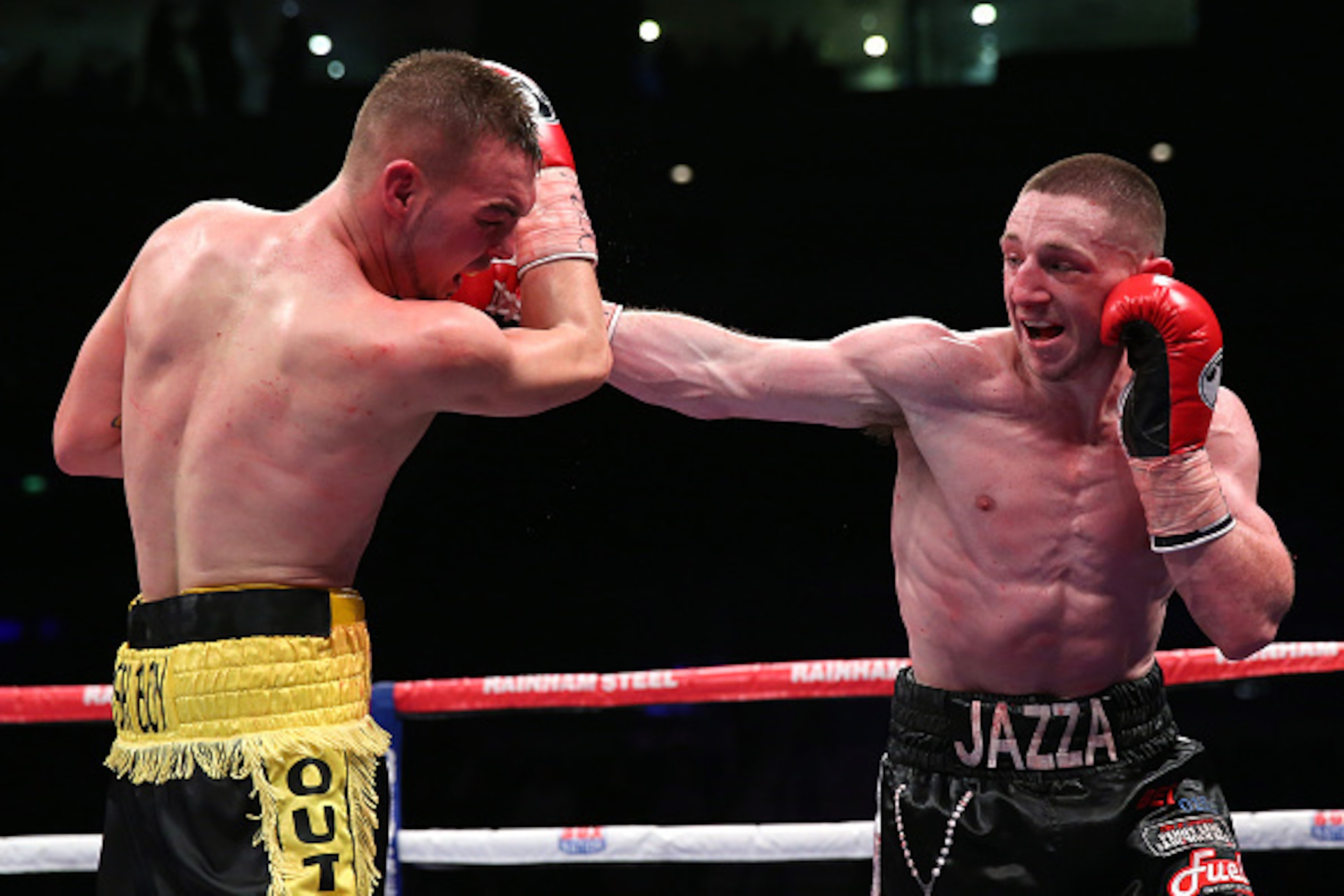 LIVERPOOL, ENGLAND - MARCH 06:  Jazza Dickens lands a right punch on Josh Wale during the Vacant British Super-Bantamweight Championship fight between Jazza Dickens and Josh Wale at the Echo Arena on March 6, 2015 in Liverpool, England.  (Photo by Alex Li