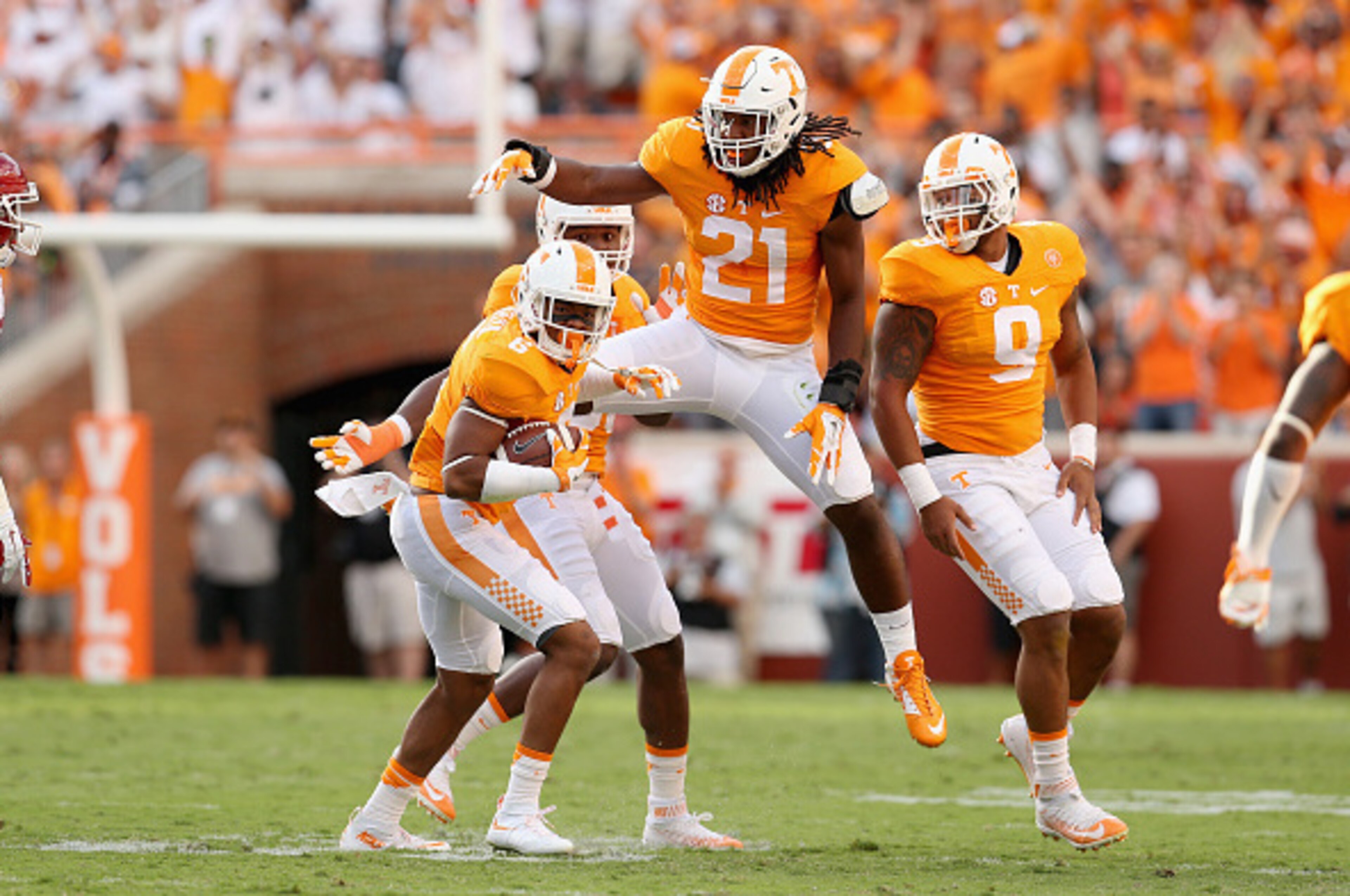 KNOXVILLE, TN - SEPTEMBER 12:  Todd Kelly Jr celebrates with Jalen Reeves-Maybin #21 of the Tennessee Volunteers after Kelly intercepted a pass against the Oklahoma Sooners during the game at Neyland Stadium on September 12, 2015 in Knoxville, Tennessee. 