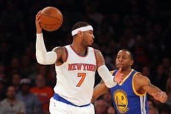 Jan 31, 2016; New York, NY, USA; New York Knicks small forward Carmelo Anthony (7) controls the ball against Golden State Warriors small forward Andre Iguodala (9) during the first quarter at Madison Square Garden. Mandatory Credit: Brad Penner-USA TODAY 