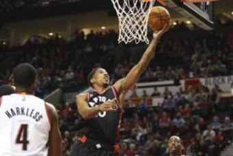 Feb 04, 2016; Portland, OR, USA; Toronto Raptors guard DeMar DeRozan (10) scores over Portland Trail Blazers at Moda Center at the Rose Quarter. Mandatory Credit: Jaime Valdez-USA TODAY Sports