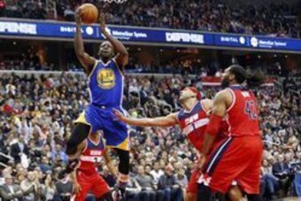Feb 3, 2016; Washington, DC, USA; Golden State Warriors forward Draymond Green (23) shoots the ball as Washington Wizards forward Jared Dudley (1) defends in the second quarter at Verizon Center. The Warriors won 134-121. Mandatory Credit: Geoff Burke-USA