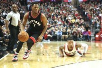 Feb 04, 2016; Portland, OR, USA; Toronto Raptors guard Kyle Lowry (7) drives to the basket after getting a loose ball against Portland Trail Blazers guard Damian Lillard (0) at Moda Center at the Rose Quarter. Mandatory Credit: Jaime Valdez-USA TODAY Spor