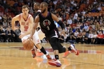 Feb 7, 2016; Miami, FL, USA; Los Angeles Clippers guard Chris Paul (3) drives to the basket as Miami Heat guard Goran Dragic (7) applies pressure during the first half at American Airlines Arena. Mandatory Credit: Steve Mitchell-USA TODAY Sports