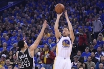 January 25, 2016; Oakland, CA, USA; Golden State Warriors guard Klay Thompson (11) shoots the basketball against San Antonio Spurs guard Danny Green (14) during the first quarter at Oracle Arena. Mandatory Credit: Kyle Terada-USA TODAY Sports