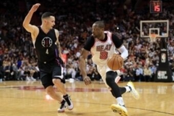 Feb 7, 2016; Miami, FL, USA; Miami Heat guard Dwyane Wade (3) drives to the basket as Los Angeles Clippers guard J.J. Redick (4) applies pressure during the second half at American Airlines Arena. The Clippers won 100-93. Mandatory Credit: Steve Mitchell-