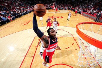 HOUSTON, TX - JANUARY 30: John Wall #2 of the Washington Wizards goes for the dunk during the game against the Houston Rockets on January 30, 2016 at the Toyota Center in Houston, Texas. NOTE TO USER: User expressly acknowledges and agrees that, by downlo