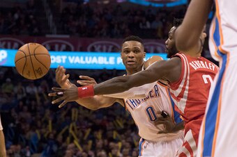OKLAHOMA CITY, OK - JANUARY 29: Patrick Beverley #2 of the Houston Rockets forces Russell Westbrook #0 of the Oklahoma City Thunder to pass the ball to Kevin Durant during the third quarter of a NBA game at the Chesapeake Energy Arena on January 29, 2016 