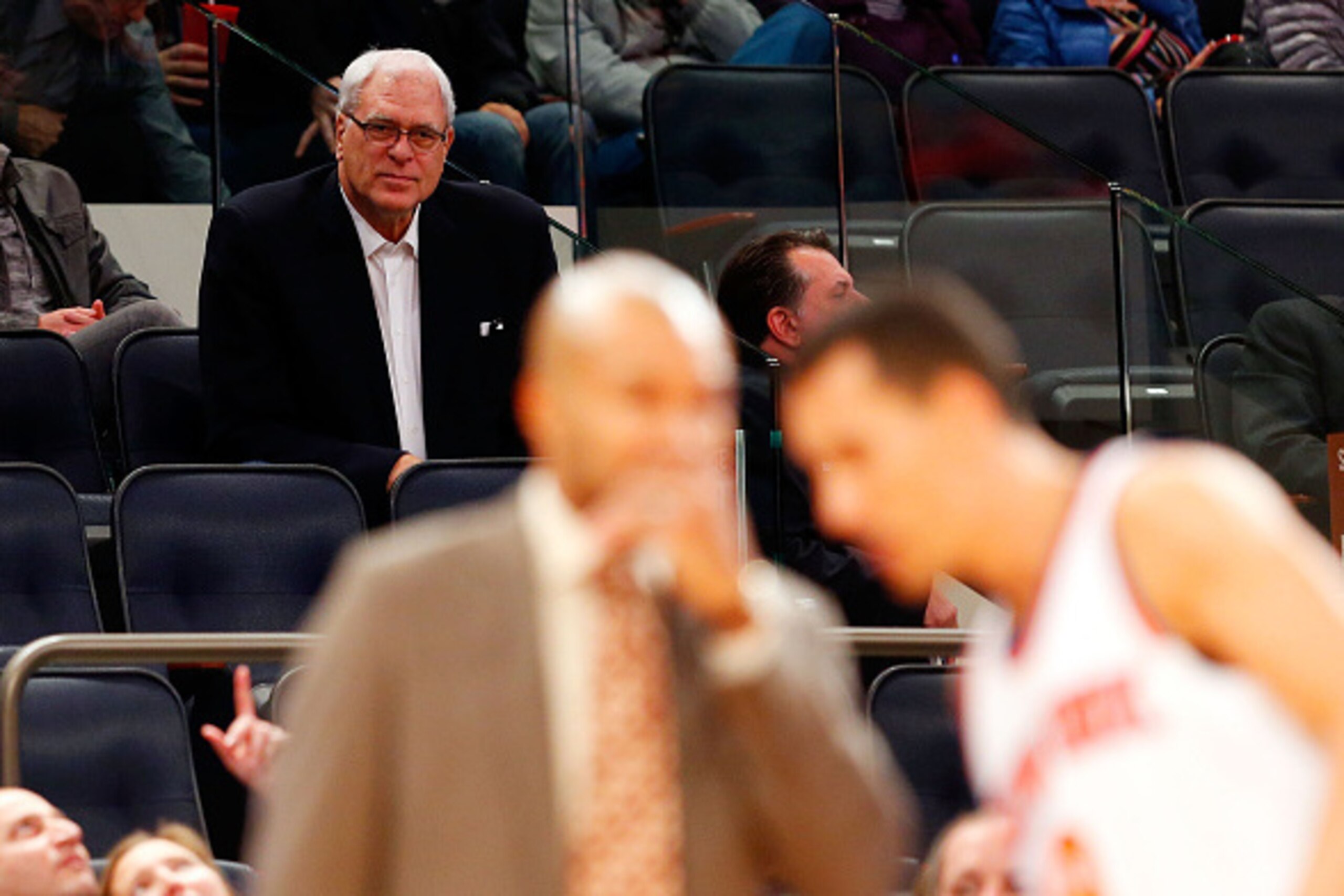 NEW YORK, NY - OCTOBER 13: (NEW YORK DAILIES OUT) New York Knicks President Phil Jackson watches his team play against the Toronto Raptors as head coach Derek Fisher talks with Pablo Prigioni #9 at Madison Square Garden on October 13, 2014 in New York NEW YORK, NY - OCTOBER 13: (NEW YORK DAILIES OUT) New York Knicks President Phil Jackson watches his team play against the Toronto Raptors as head coach Derek Fisher talks with Pablo Prigioni #9 at Madison Square Garden on October 13, 2014 in New York